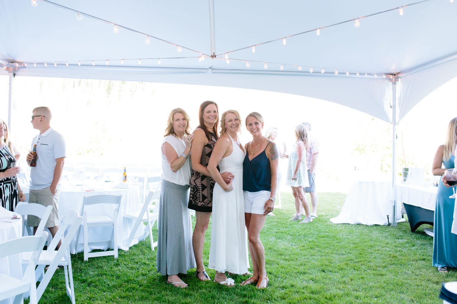 Leeanne and Kelly weddings story frame 16: A Watermark Beach Resort wedding in Osoyoos, built around lakefront context, grown-family connection and careful, big-hearted coverage..
