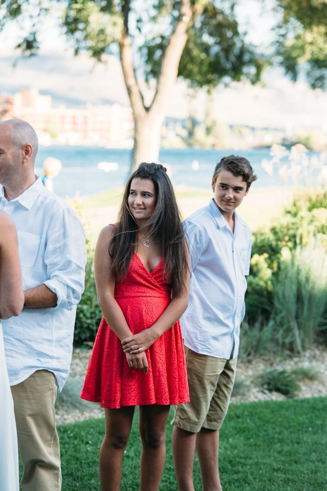 Leeanne and Kelly weddings story frame 14: A Watermark Beach Resort wedding in Osoyoos, built around lakefront context, grown-family connection and careful, big-hearted coverage..