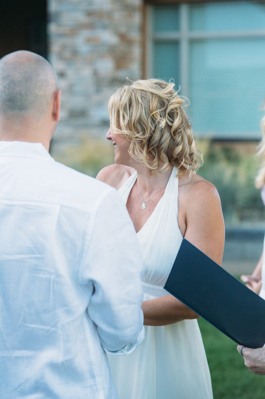 Leeanne and Kelly weddings story frame 15: A Watermark Beach Resort wedding in Osoyoos, built around lakefront context, grown-family connection and careful, big-hearted coverage..