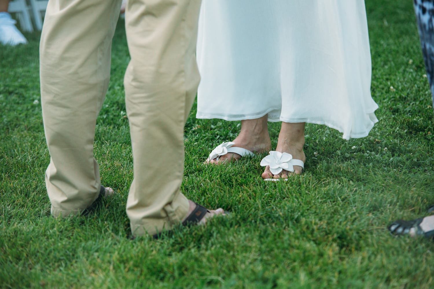 Leeanne and Kelly weddings story frame 20: A Watermark Beach Resort wedding in Osoyoos, built around lakefront context, grown-family connection and careful, big-hearted coverage..