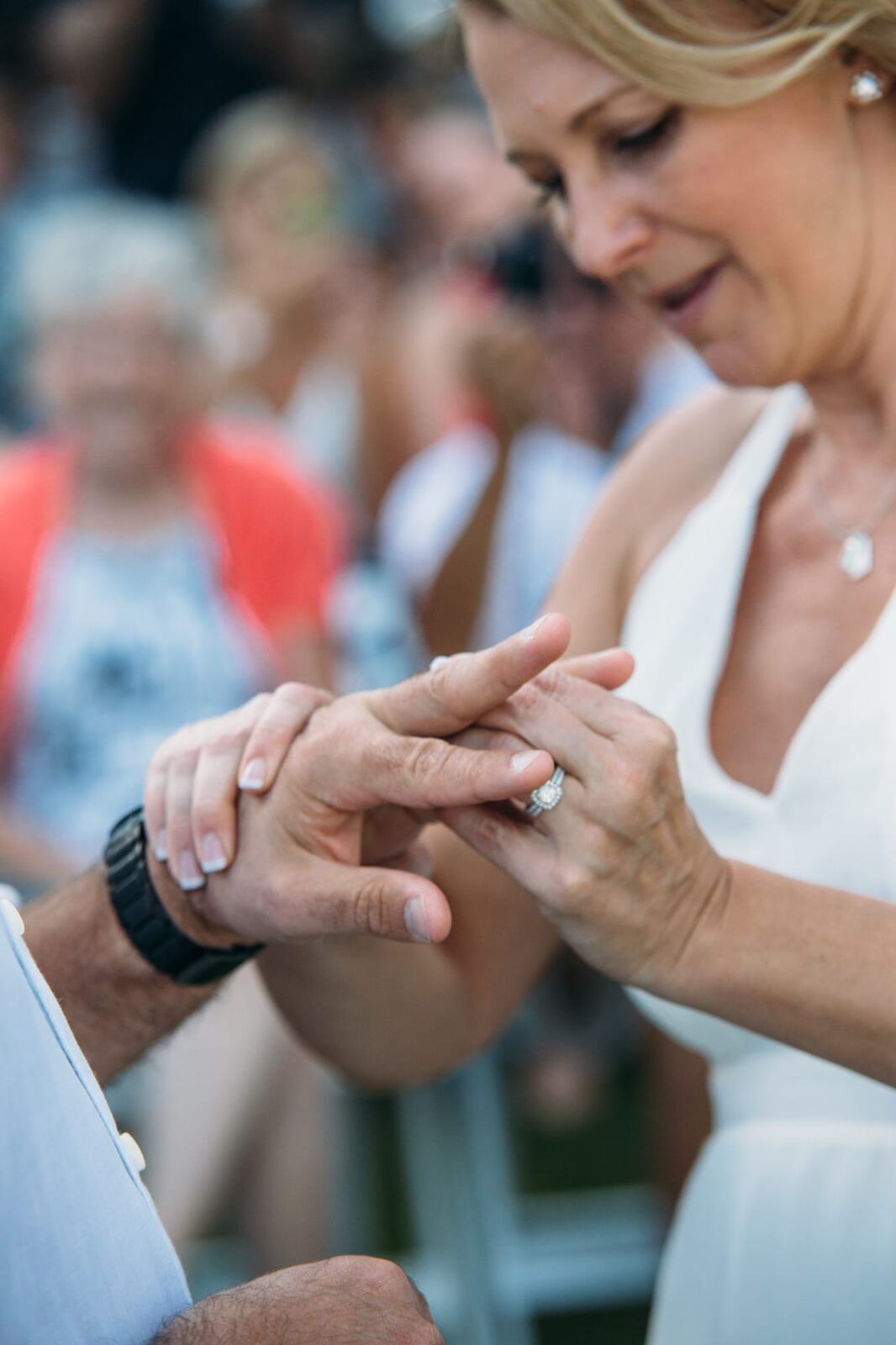 Leeanne and Kelly weddings story frame 18: A Watermark Beach Resort wedding in Osoyoos, built around lakefront context, grown-family connection and careful, big-hearted coverage..