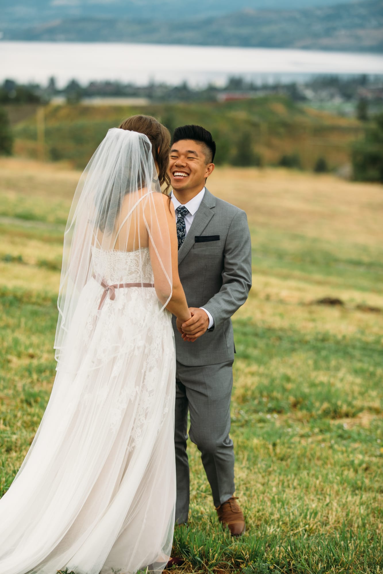 Leslie and Gerome weddings story frame 2: A Brook & Barn - Casorso Heritage Farm wedding in Kelowna, with orchard details, outbuildings, lawn games and a familiar friend-party feeling..