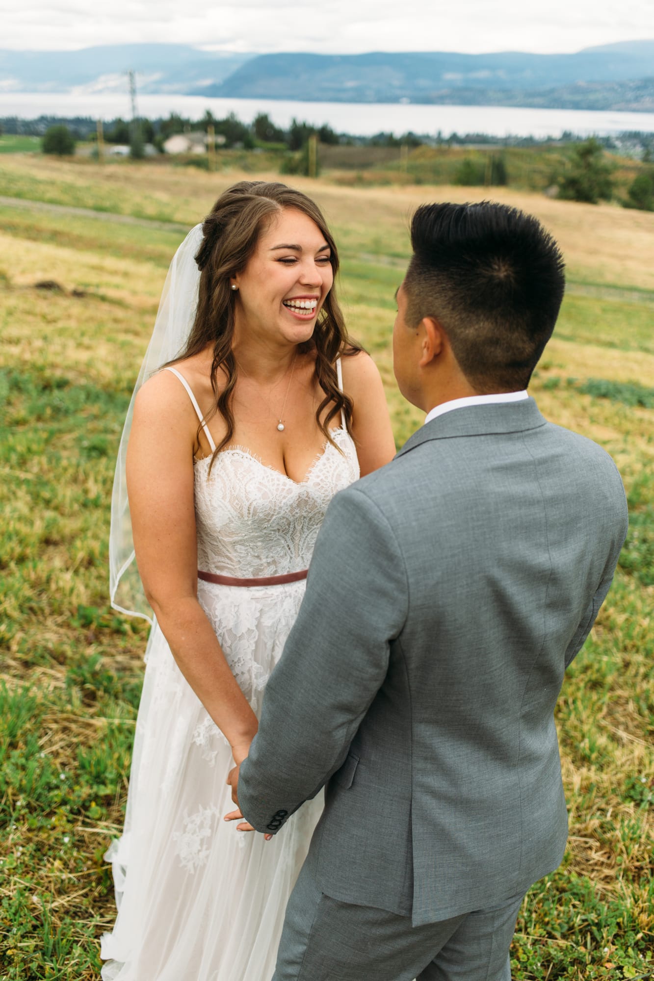 Leslie and Gerome weddings story frame 4: A Brook & Barn - Casorso Heritage Farm wedding in Kelowna, with orchard details, outbuildings, lawn games and a familiar friend-party feeling..