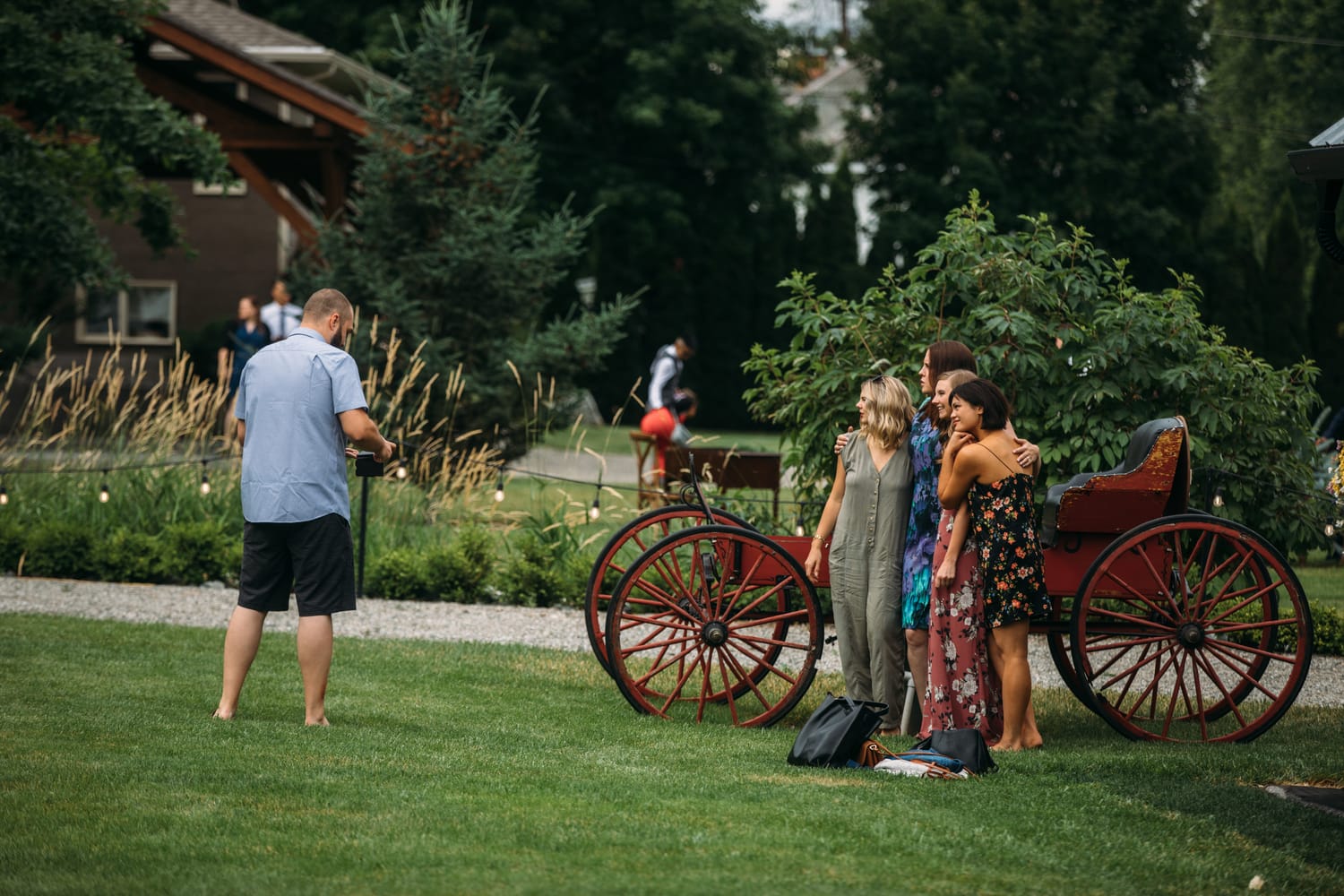 Leslie and Gerome weddings story frame 8: A Brook & Barn - Casorso Heritage Farm wedding in Kelowna, with orchard details, outbuildings, lawn games and a familiar friend-party feeling..