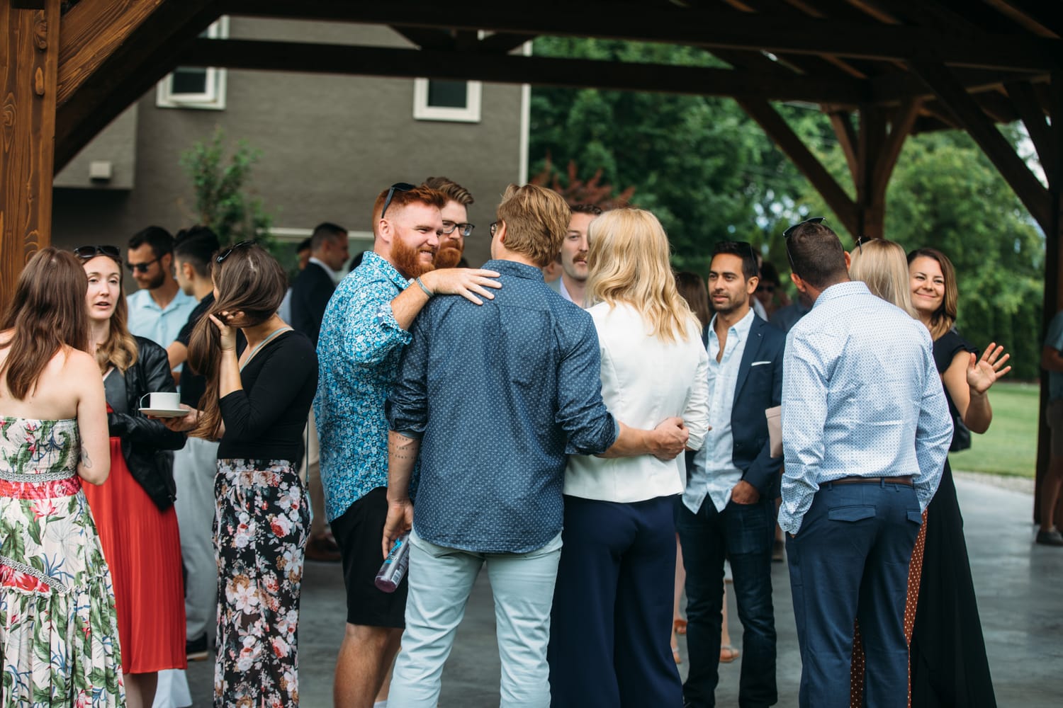 Leslie and Gerome weddings story frame 11: A Brook & Barn - Casorso Heritage Farm wedding in Kelowna, with orchard details, outbuildings, lawn games and a familiar friend-party feeling..
