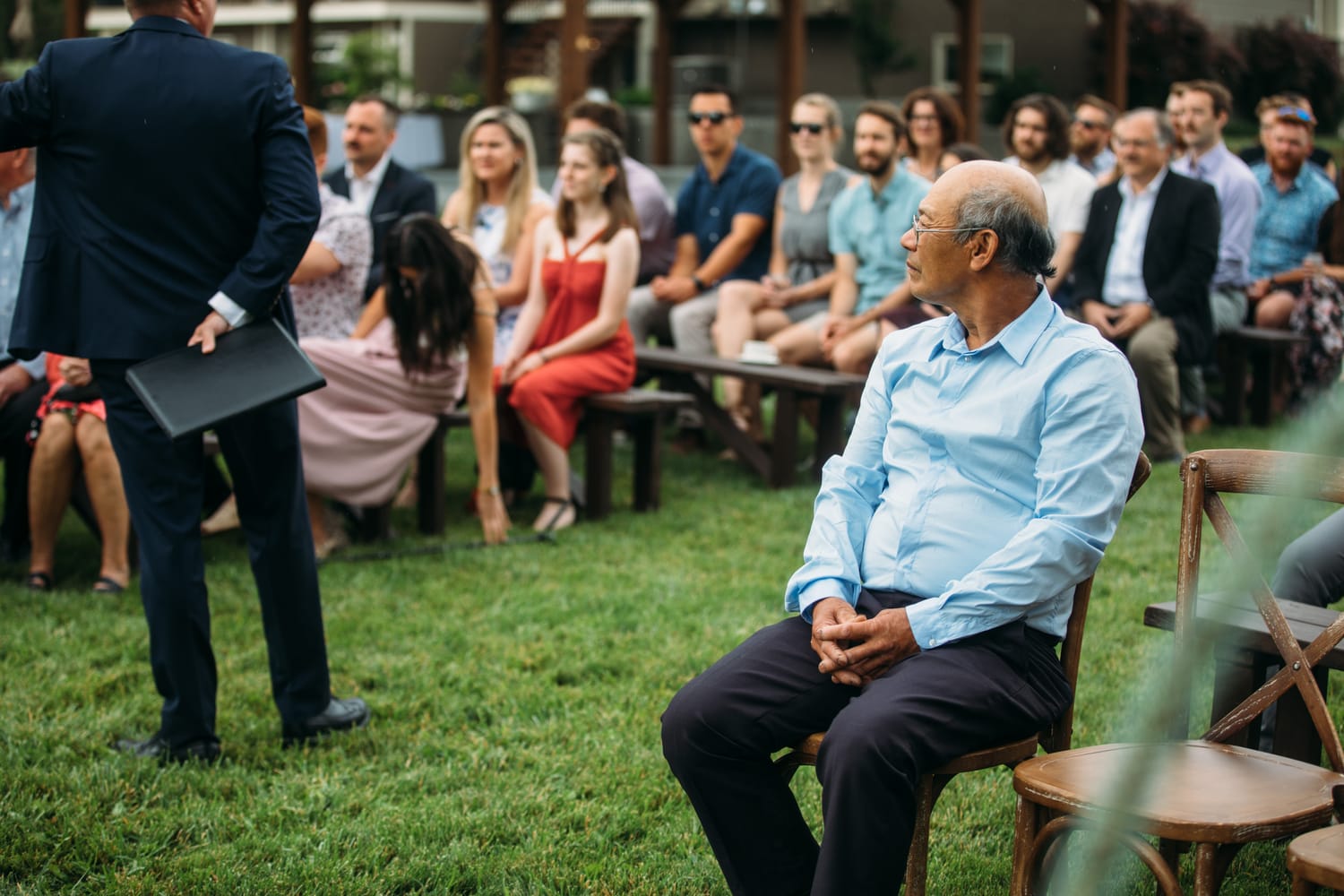 Leslie and Gerome weddings story frame 13: A Brook & Barn - Casorso Heritage Farm wedding in Kelowna, with orchard details, outbuildings, lawn games and a familiar friend-party feeling..