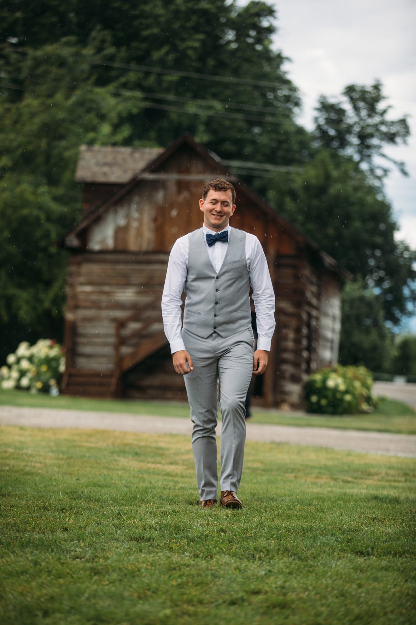 Leslie and Gerome weddings story frame 14: A Brook & Barn - Casorso Heritage Farm wedding in Kelowna, with orchard details, outbuildings, lawn games and a familiar friend-party feeling..