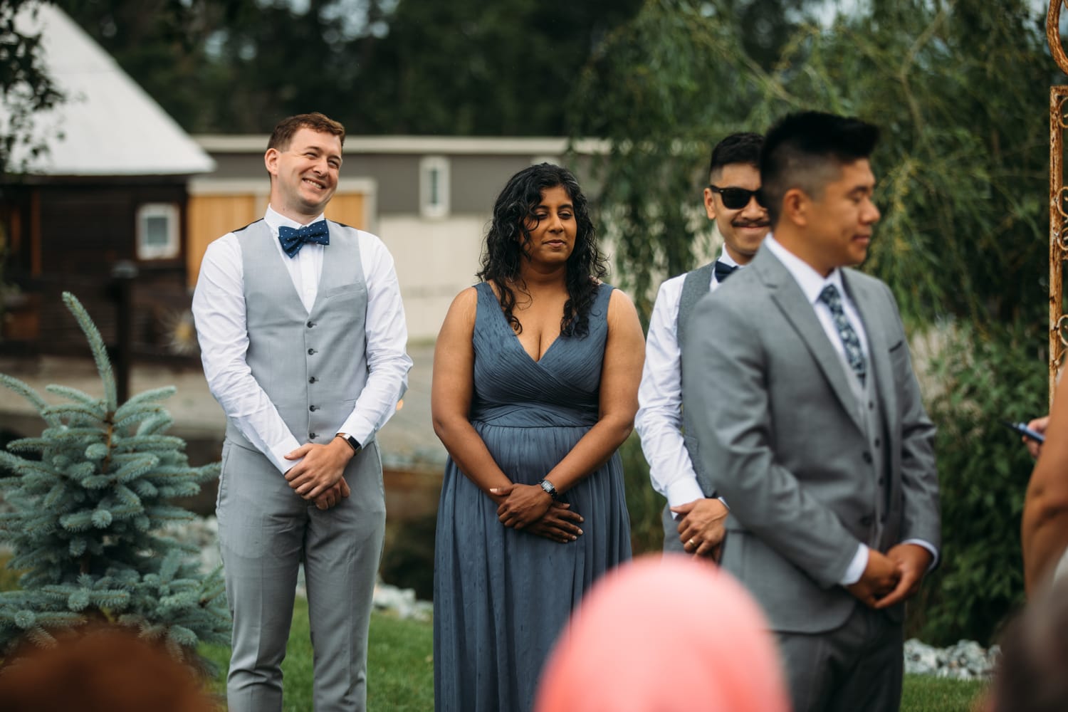 Leslie and Gerome weddings story frame 16: A Brook & Barn - Casorso Heritage Farm wedding in Kelowna, with orchard details, outbuildings, lawn games and a familiar friend-party feeling..