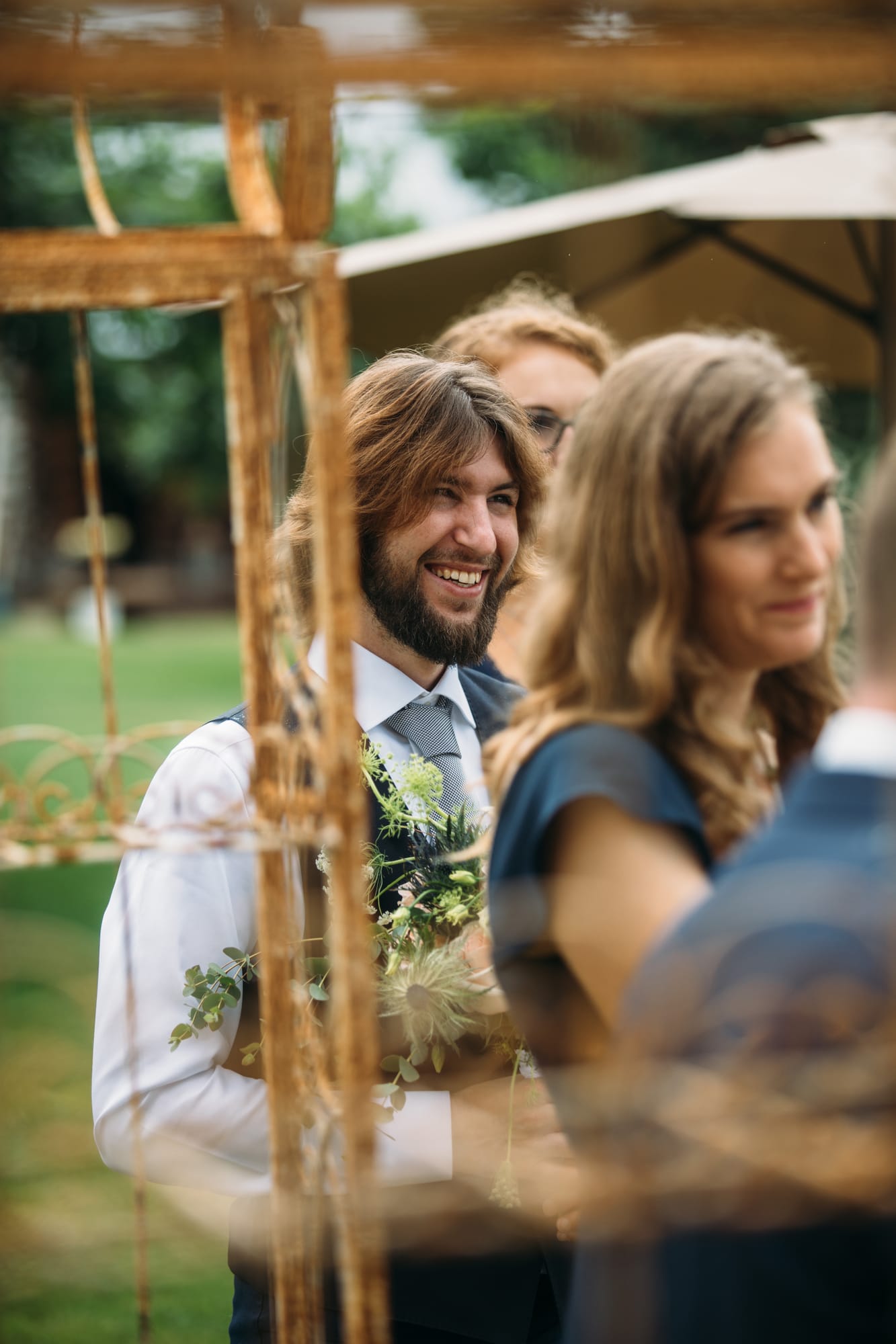Leslie and Gerome weddings story frame 18: A Brook & Barn - Casorso Heritage Farm wedding in Kelowna, with orchard details, outbuildings, lawn games and a familiar friend-party feeling..