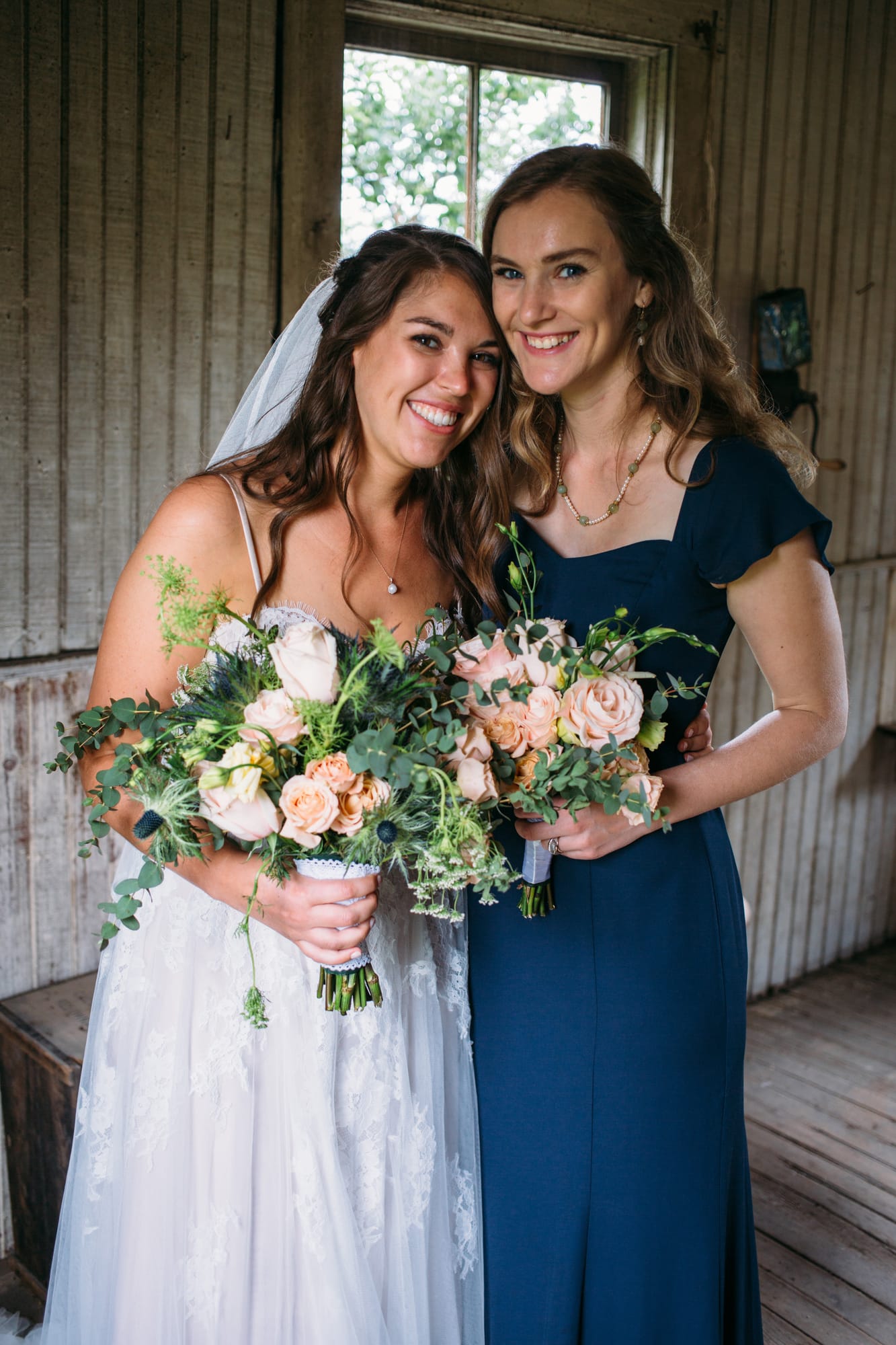 Leslie and Gerome weddings story frame 23: A Brook & Barn - Casorso Heritage Farm wedding in Kelowna, with orchard details, outbuildings, lawn games and a familiar friend-party feeling..