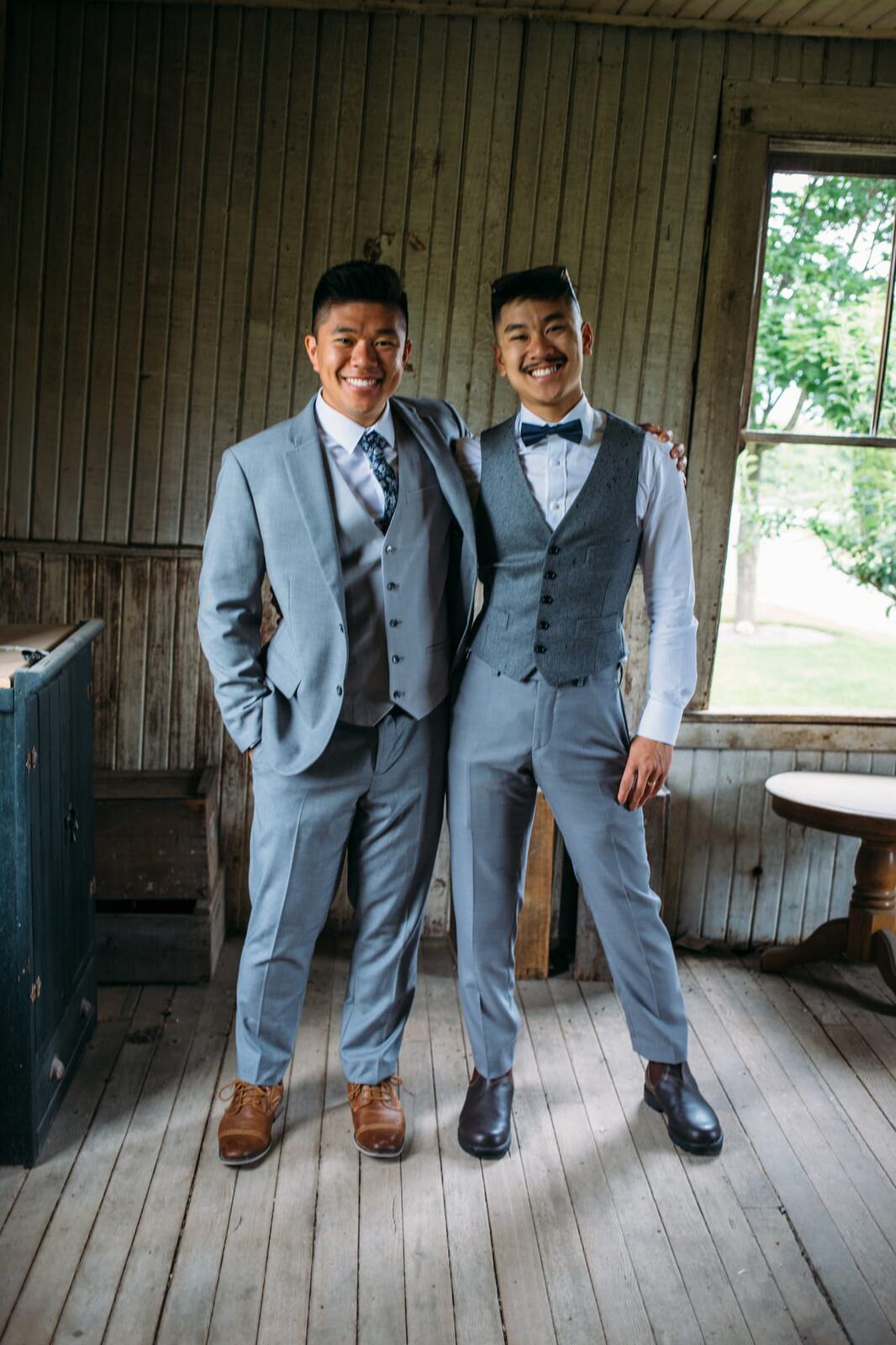 Leslie and Gerome weddings story frame 20: A Brook & Barn - Casorso Heritage Farm wedding in Kelowna, with orchard details, outbuildings, lawn games and a familiar friend-party feeling..