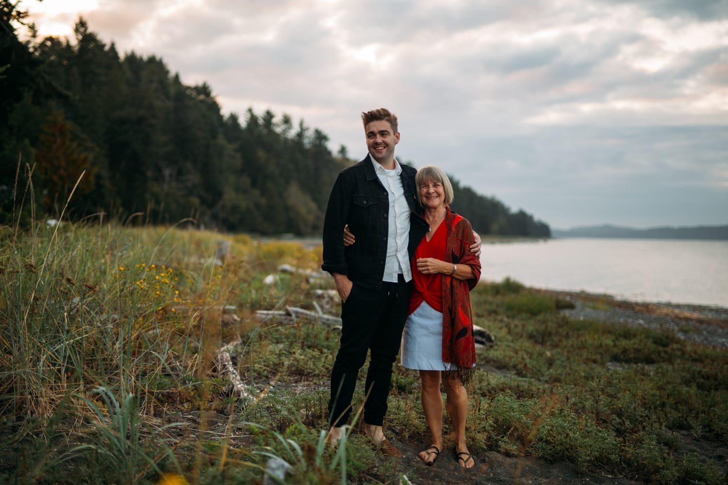 Mara and Casey weddings story frame 9: A Vancouver Island private-home wedding near Qualicum Beach, with Bowser prep, Friday gathering energy, custom vendors, kids, friends and cool Island air..