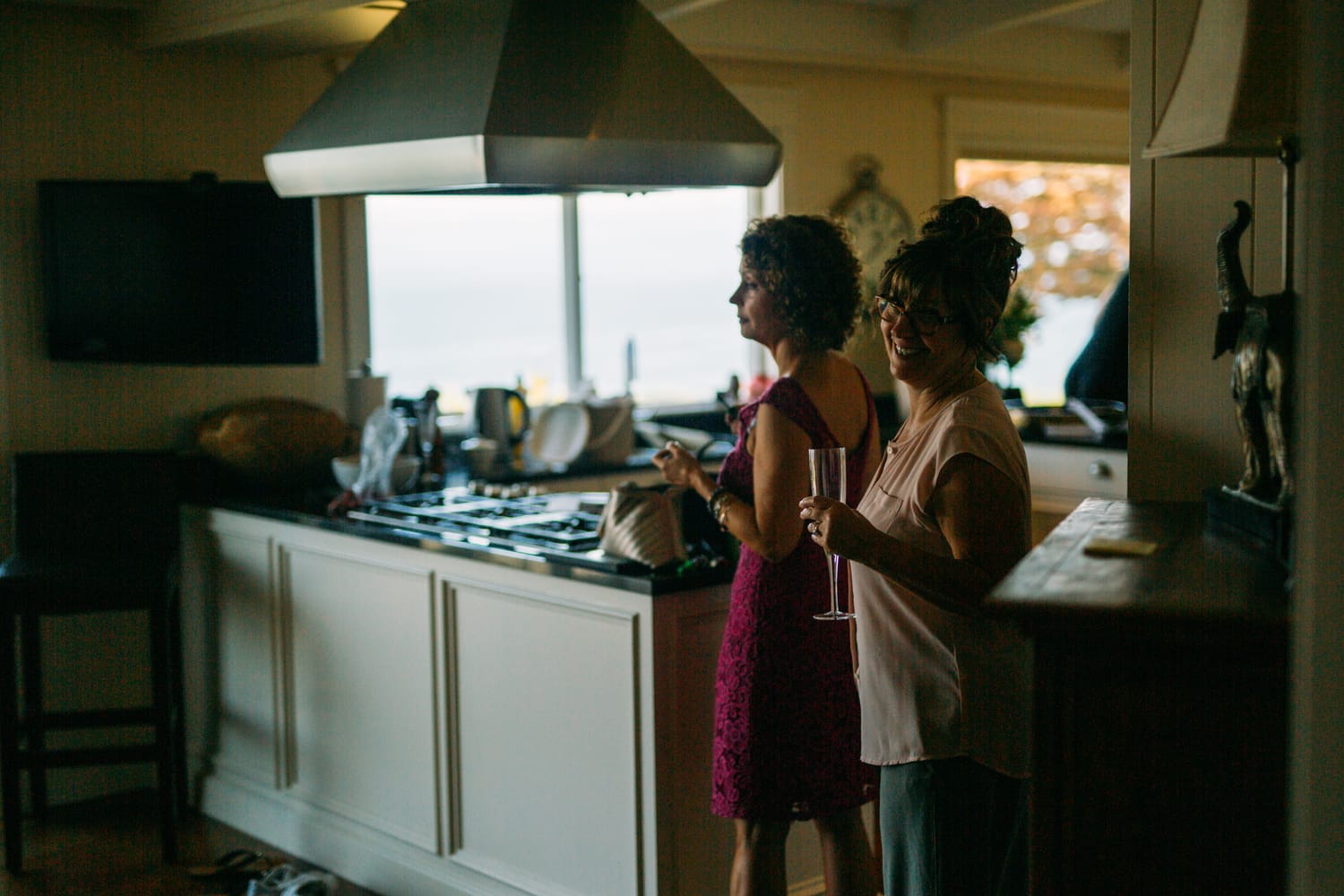 Mara and Casey weddings story frame 12: A Vancouver Island private-home wedding near Qualicum Beach, with Bowser prep, Friday gathering energy, custom vendors, kids, friends and cool Island air..