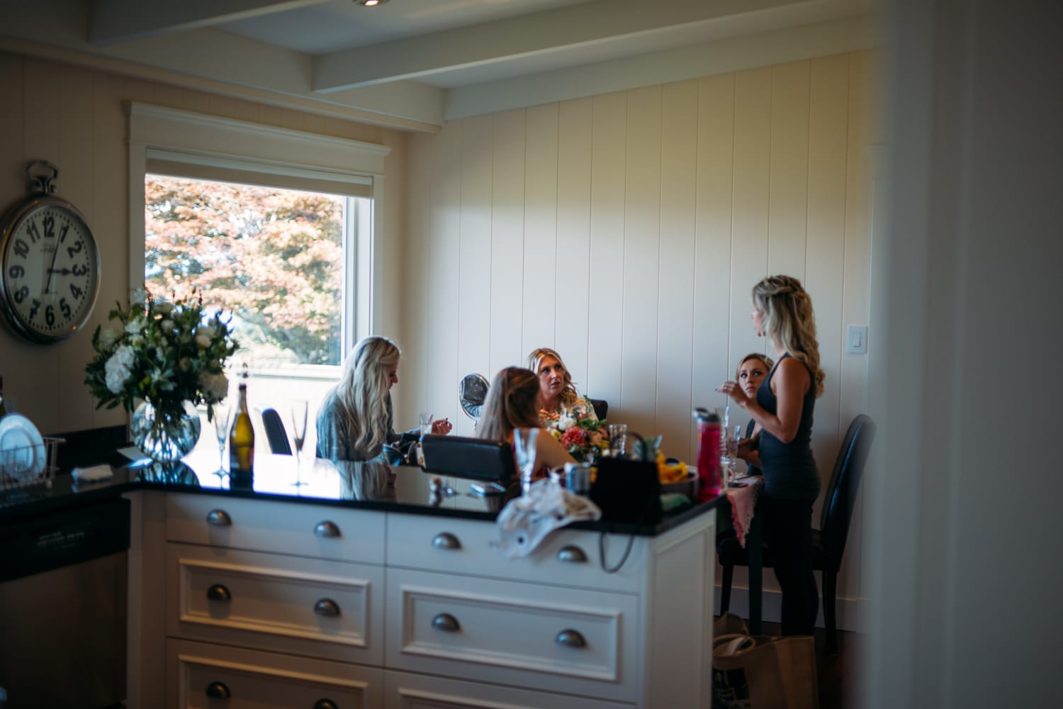 Mara and Casey weddings story frame 18: A Vancouver Island private-home wedding near Qualicum Beach, with Bowser prep, Friday gathering energy, custom vendors, kids, friends and cool Island air..