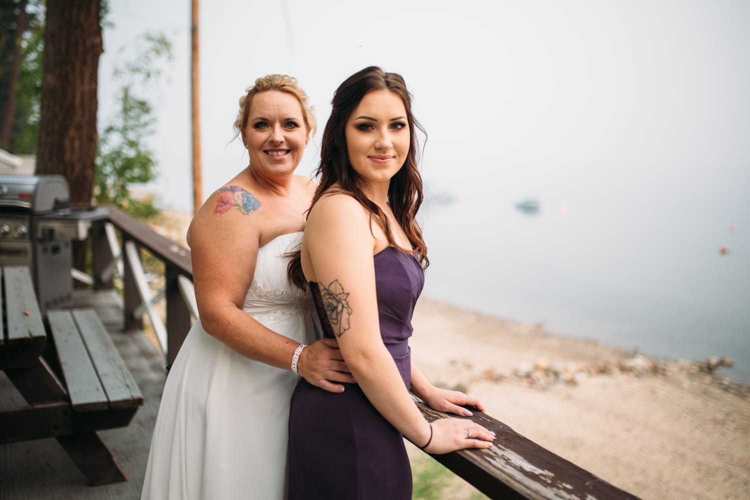Marie and Mark weddings story frame 12: A Mabel Lake Airpark wedding in the North Okanagan, with grass-runway scenery, open-air photos and sweet family help around makeup, flowers and petals..