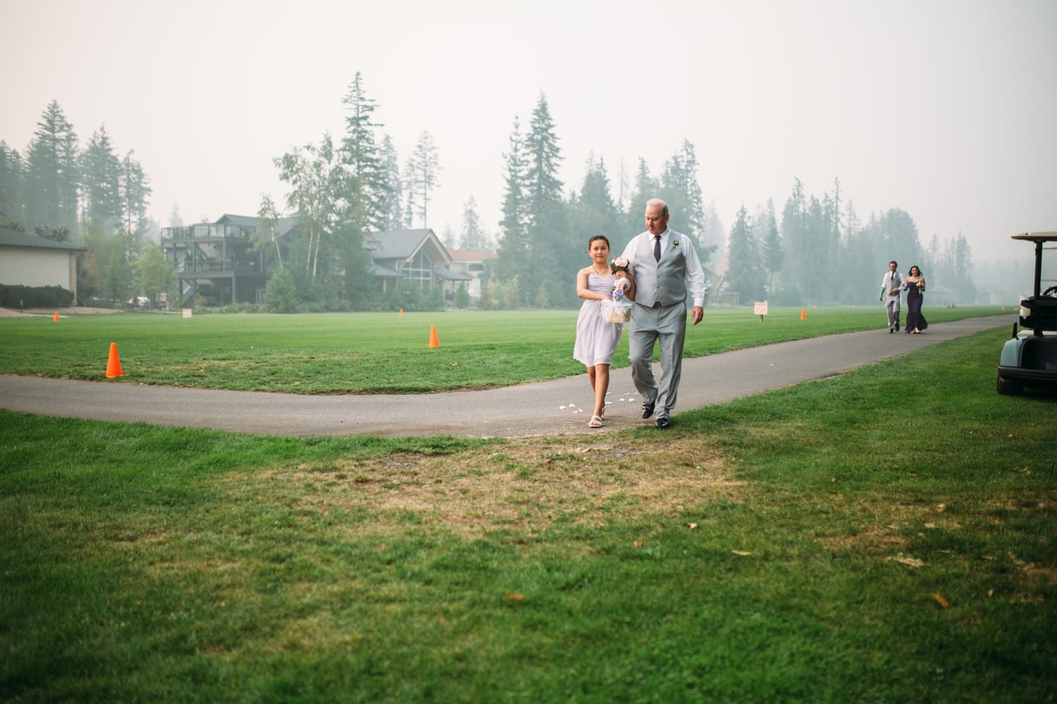Marie and Mark weddings story frame 16: A Mabel Lake Airpark wedding in the North Okanagan, with grass-runway scenery, open-air photos and sweet family help around makeup, flowers and petals..