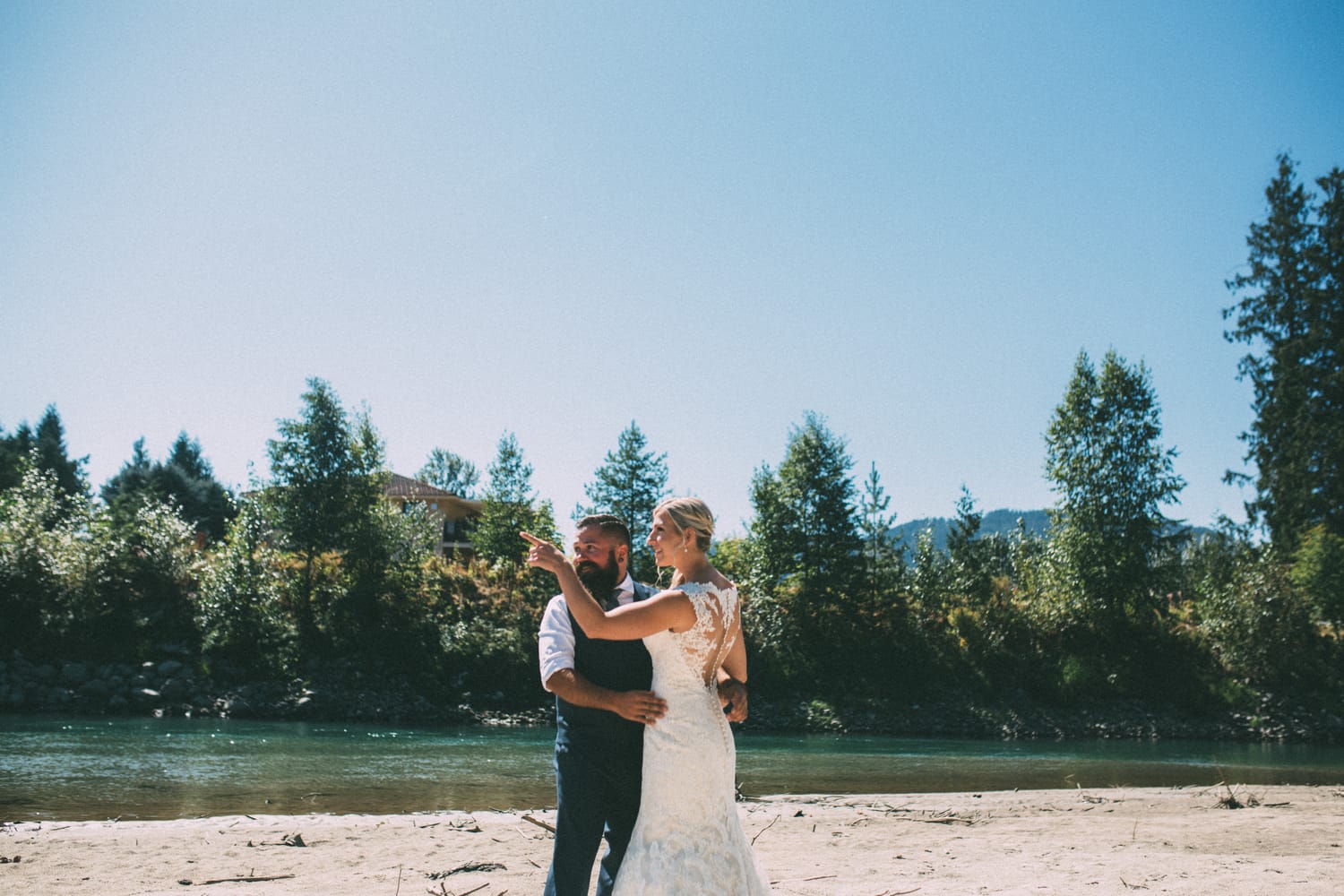 Megan and Jarid weddings story frame 4: A Shuswap-area wedding around Sicamous, Swansea Point and Hyde Mountain, with boat/lake context, cliff portraits and strong floral colour..