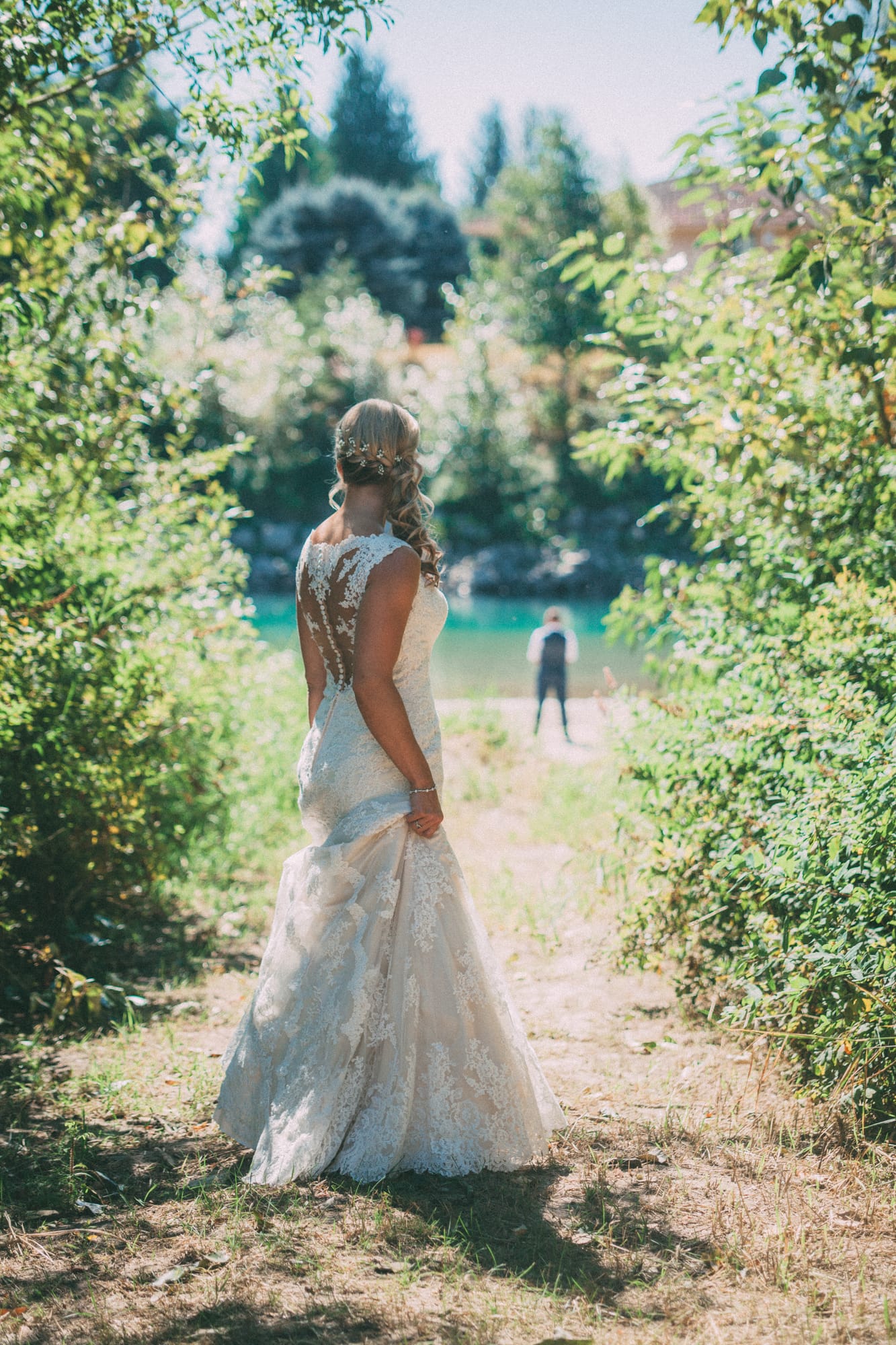 Megan and Jarid weddings story frame 5: A Shuswap-area wedding around Sicamous, Swansea Point and Hyde Mountain, with boat/lake context, cliff portraits and strong floral colour..