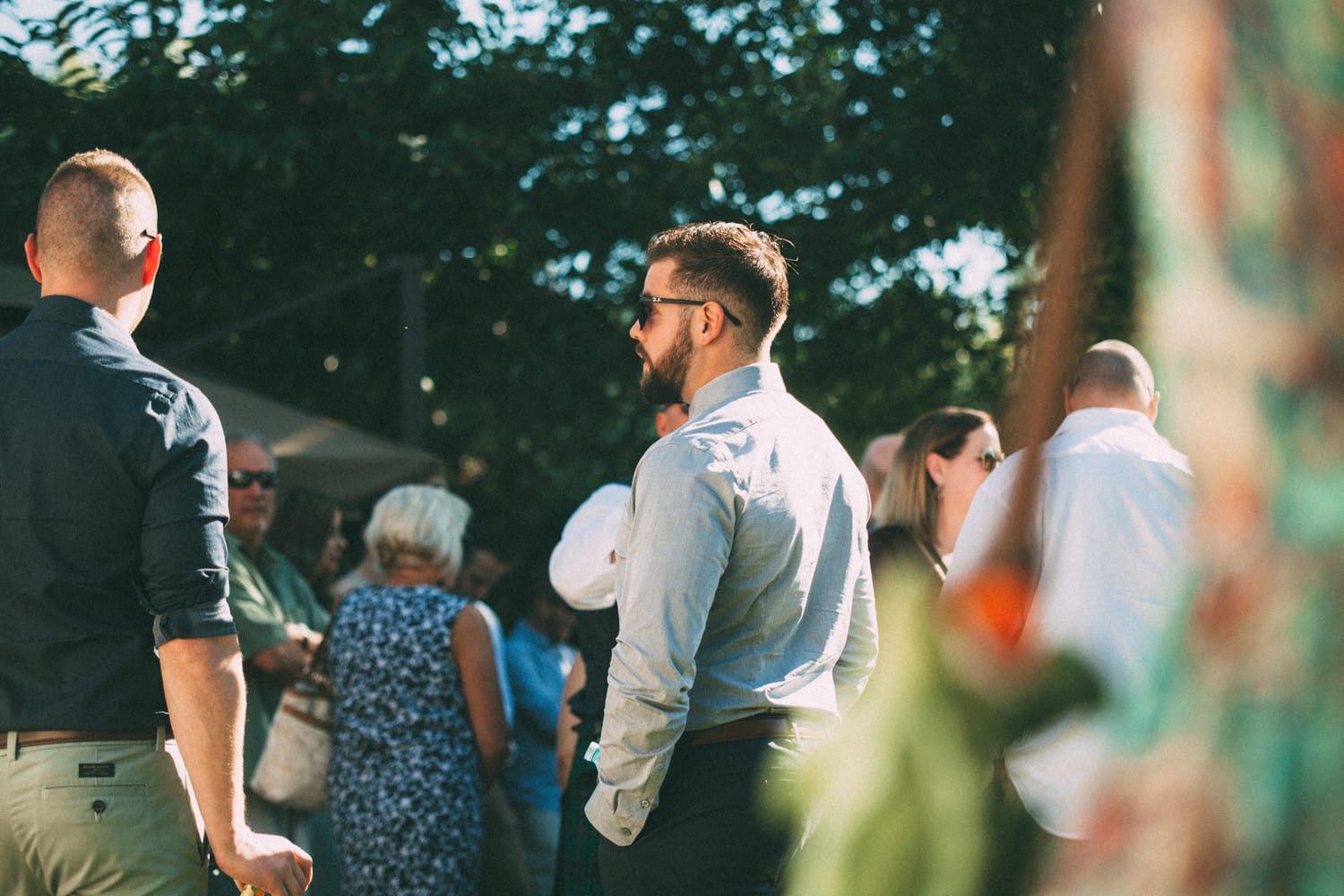 Megan and Jarid weddings story frame 19: A Shuswap-area wedding around Sicamous, Swansea Point and Hyde Mountain, with boat/lake context, cliff portraits and strong floral colour..