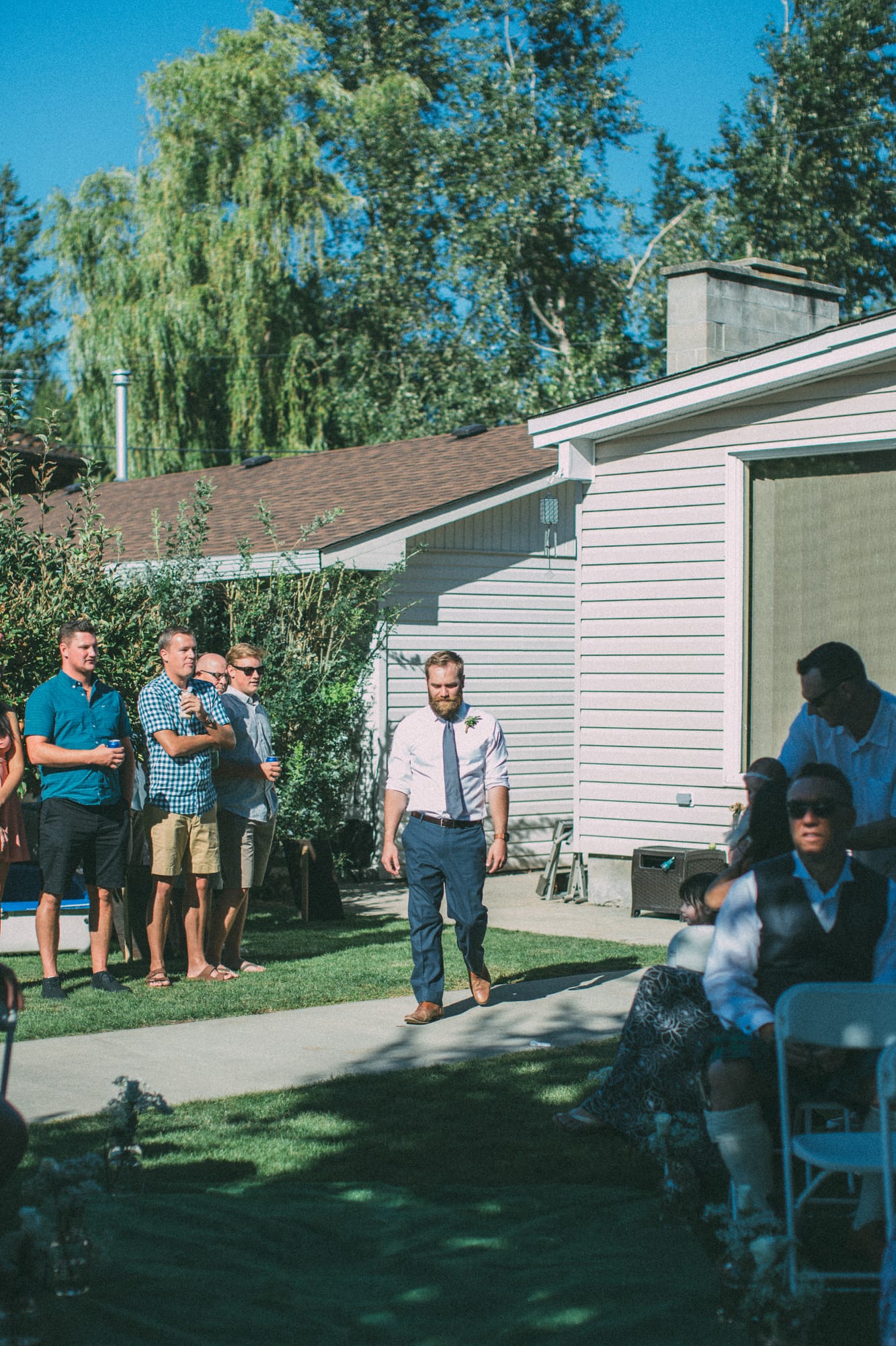 Megan and Jarid weddings story frame 21: A Shuswap-area wedding around Sicamous, Swansea Point and Hyde Mountain, with boat/lake context, cliff portraits and strong floral colour..