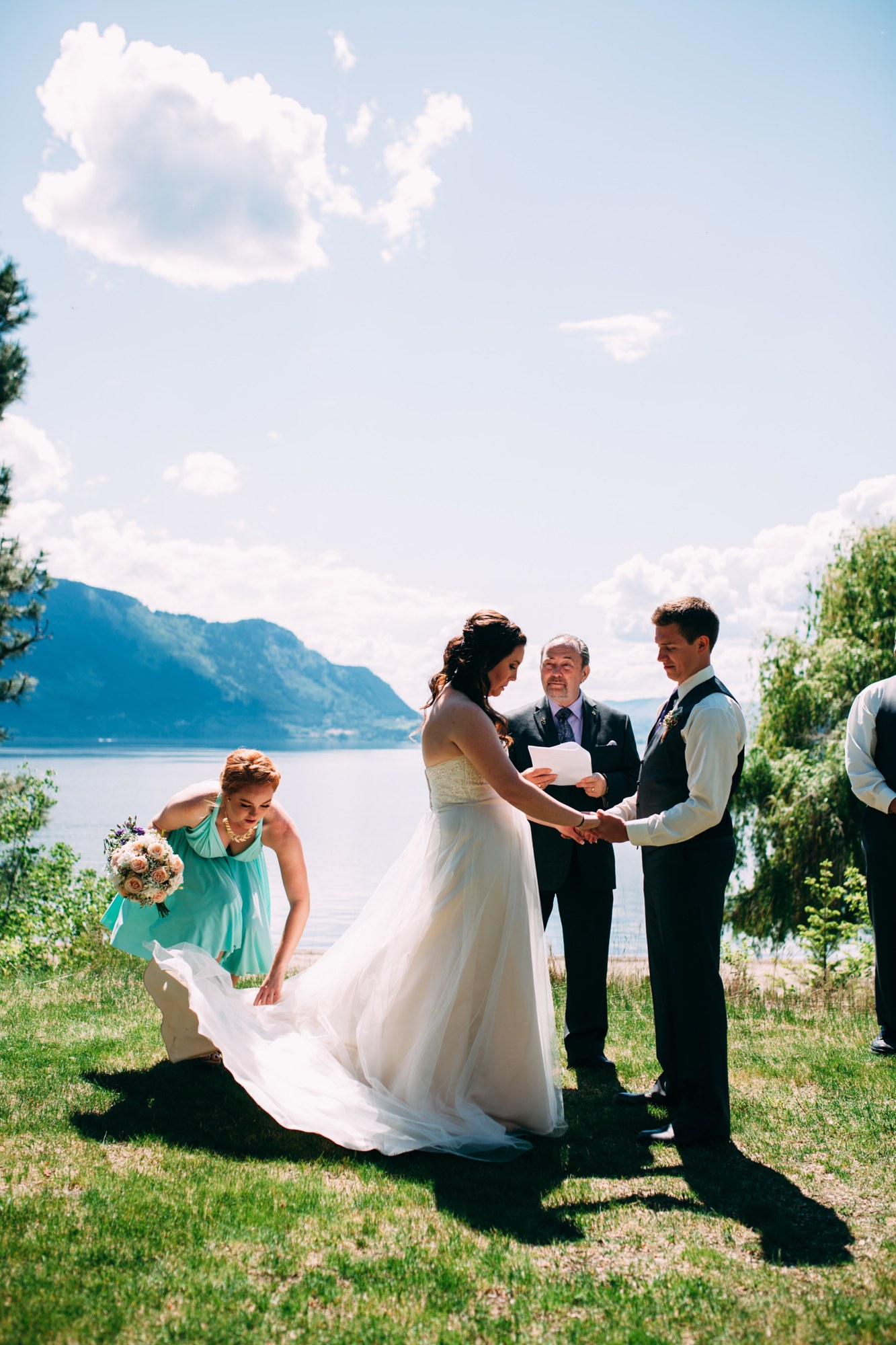 Mel & Eric: The couple exchanging vows above the lake.