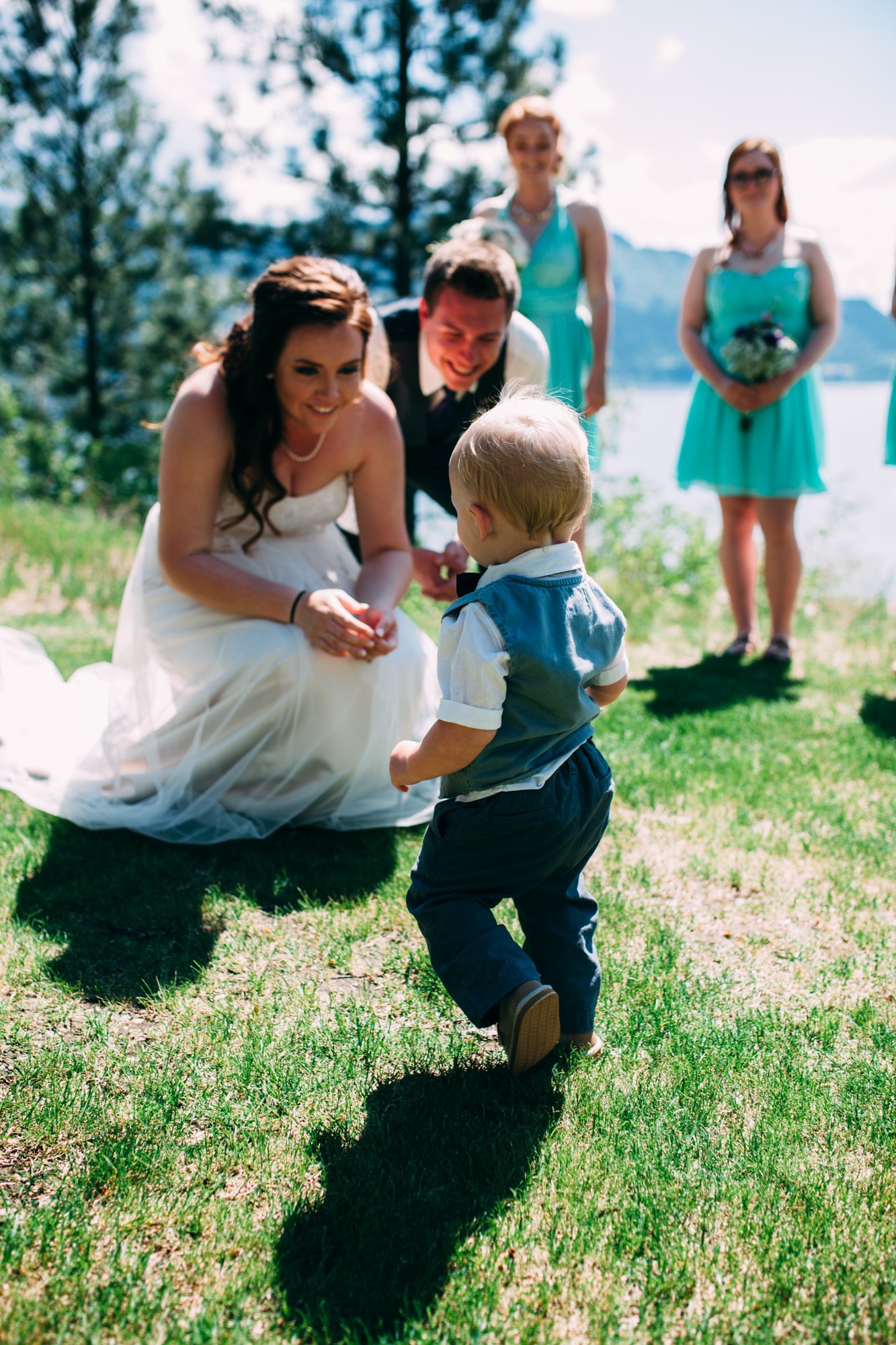 Mel & Eric: The bride greeting a child during the ceremony.