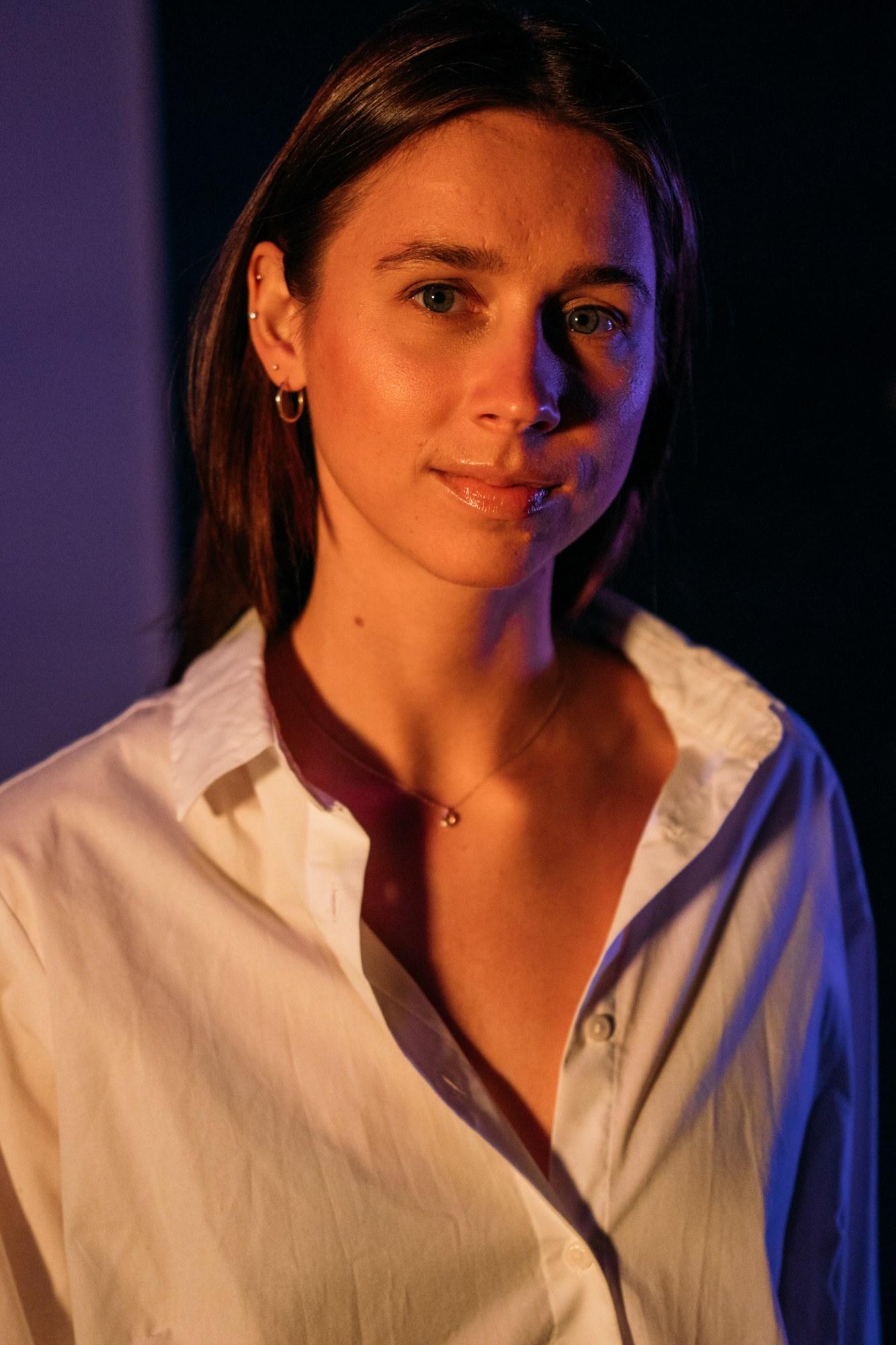 Our Yoga Space Studio Portraits: Warm gold-light portrait with a gentle smile.