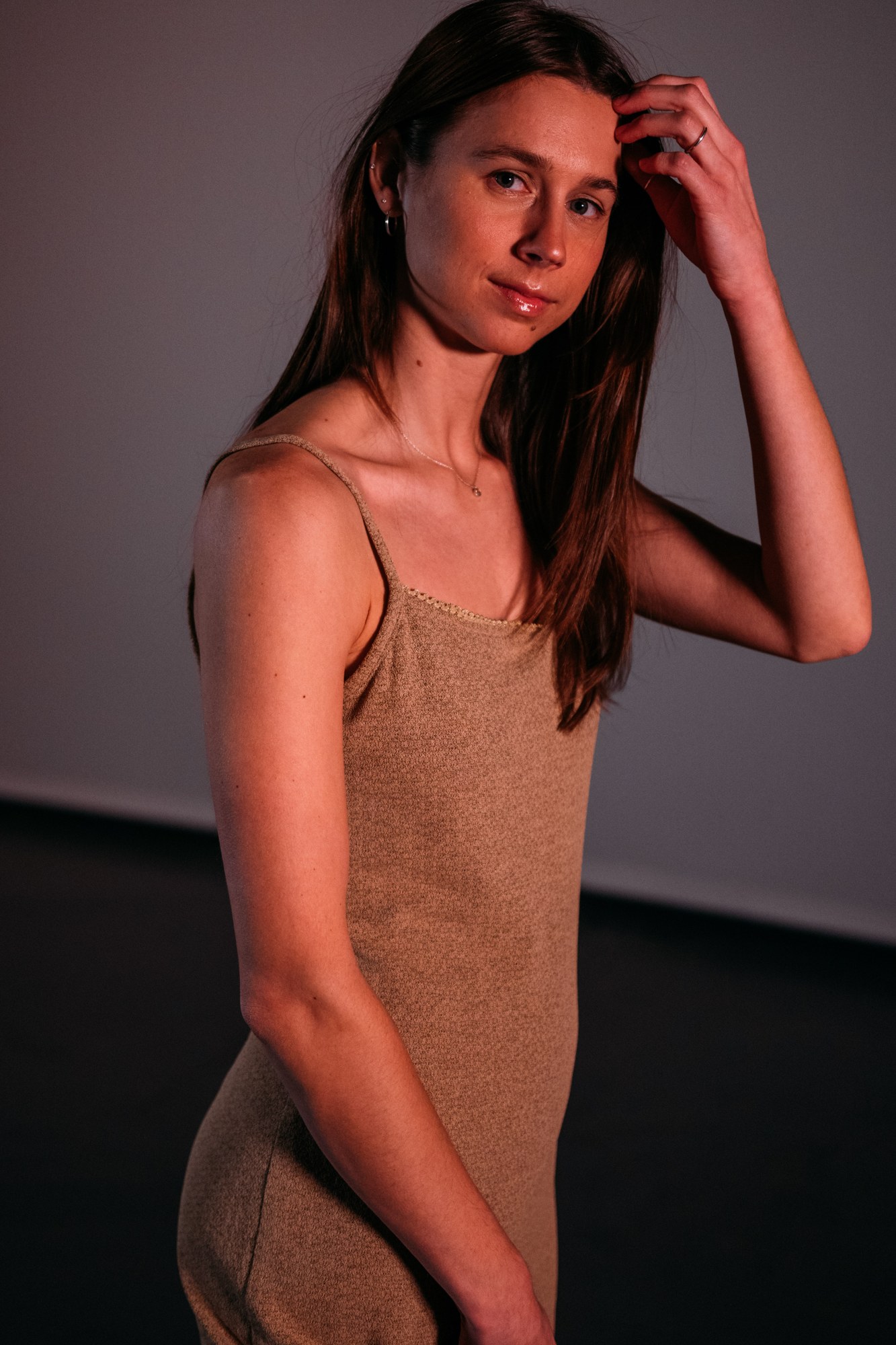 Our Yoga Space Studio Portraits: Direct gaze and relaxed hand beside the hair.