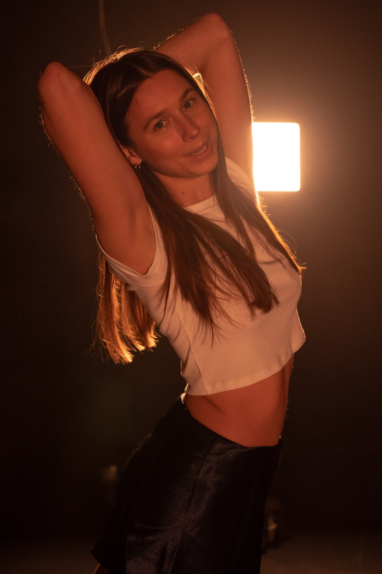 Our Yoga Space Studio Portraits: Close portrait with an extended arm gesture.