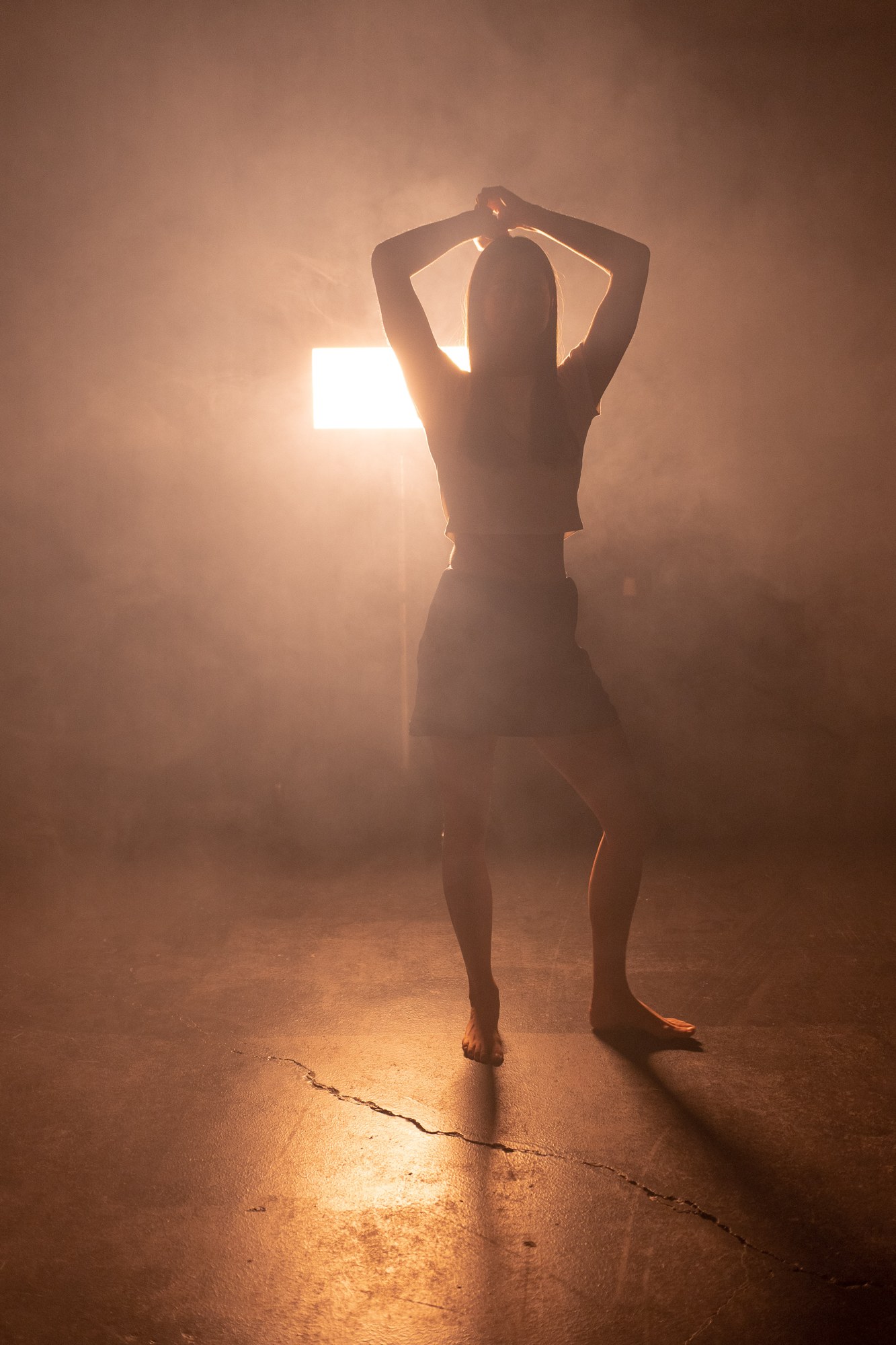 Our Yoga Space Studio Portraits: Full raised-arm silhouette in the haze.