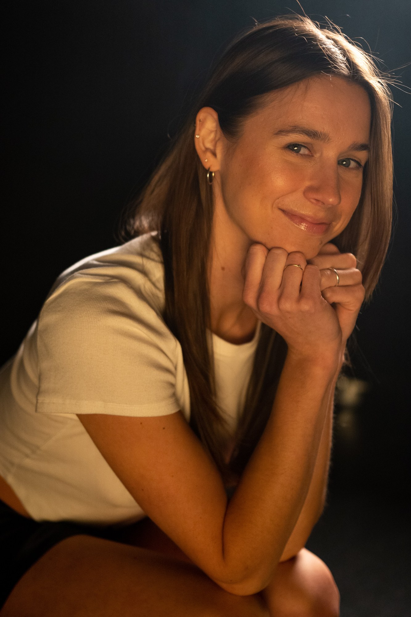 Our Yoga Space Studio Portraits: Friendly close portrait resting on folded hands.