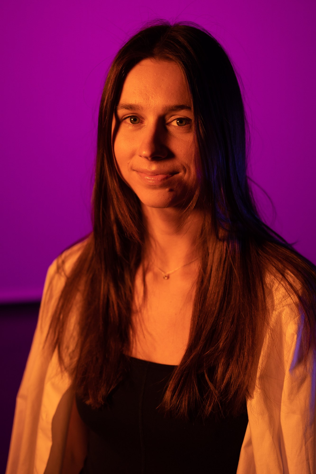 Our Yoga Space Studio Portraits: Quiet warm gaze against saturated pink.