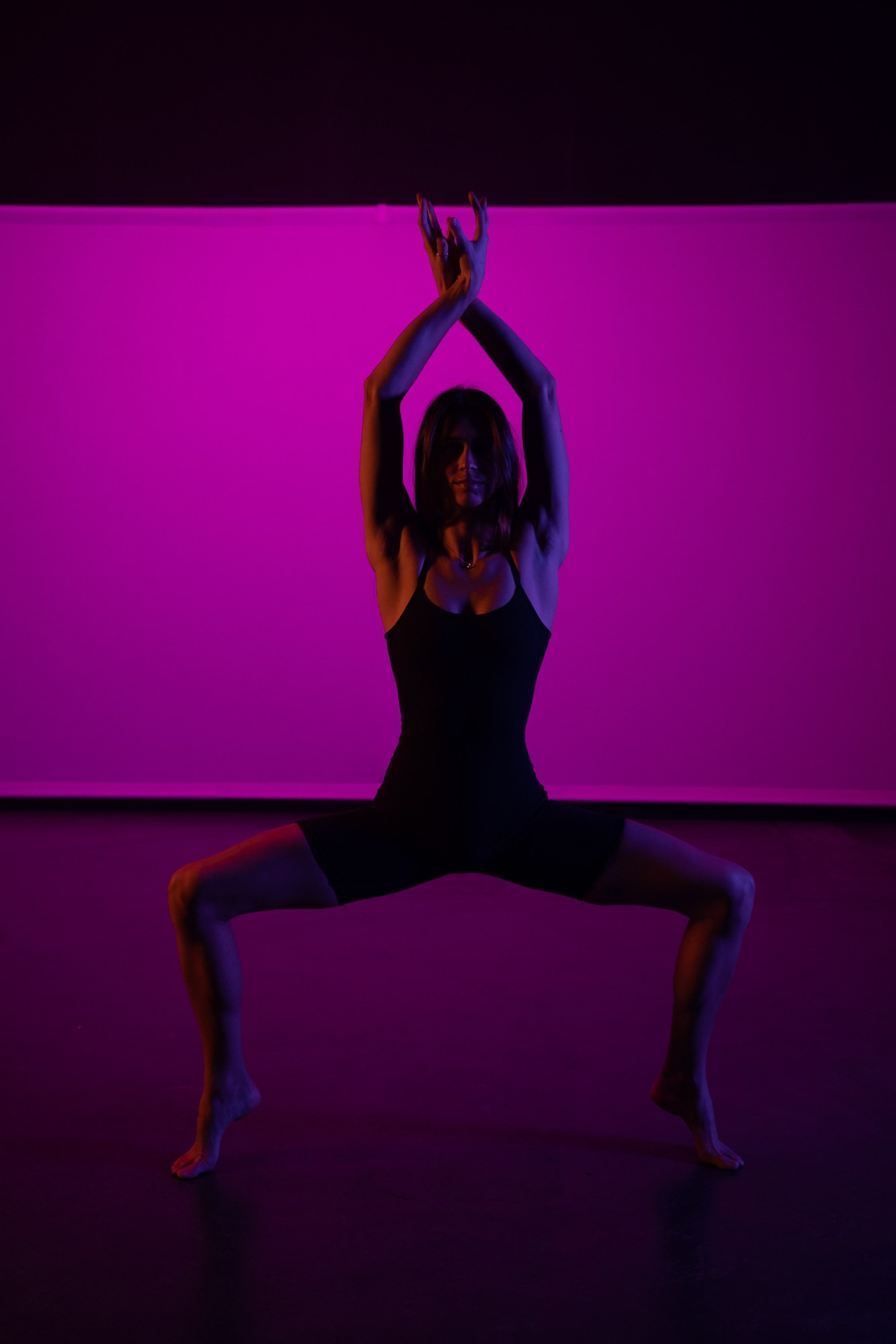 Our Yoga Space Studio Portraits: Balanced low dance shape with raised arms.