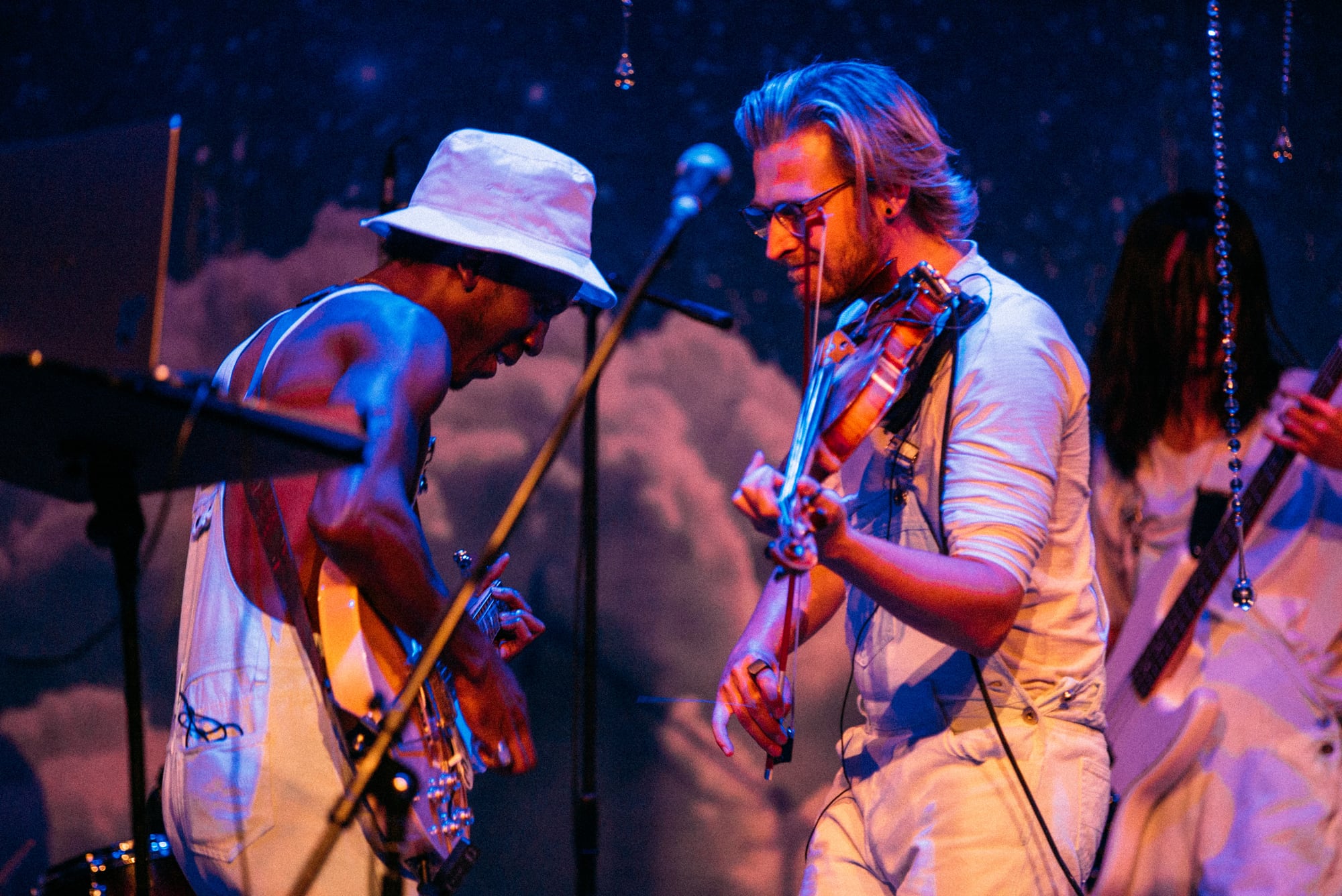 Two musicians singing together during the MusicBC performance.