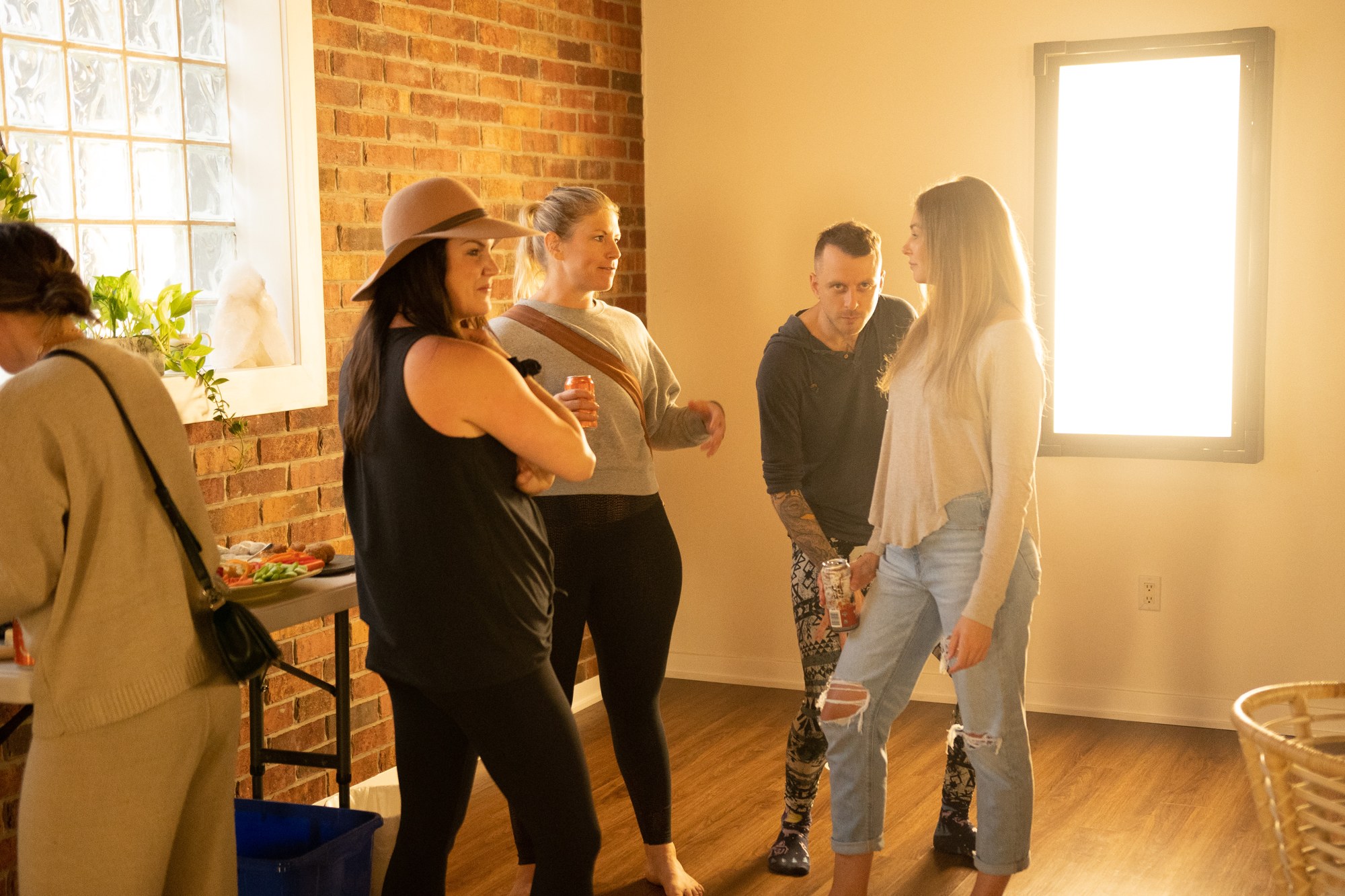Our Yoga Space Turns Three: Conversation and shared smiles by the window.