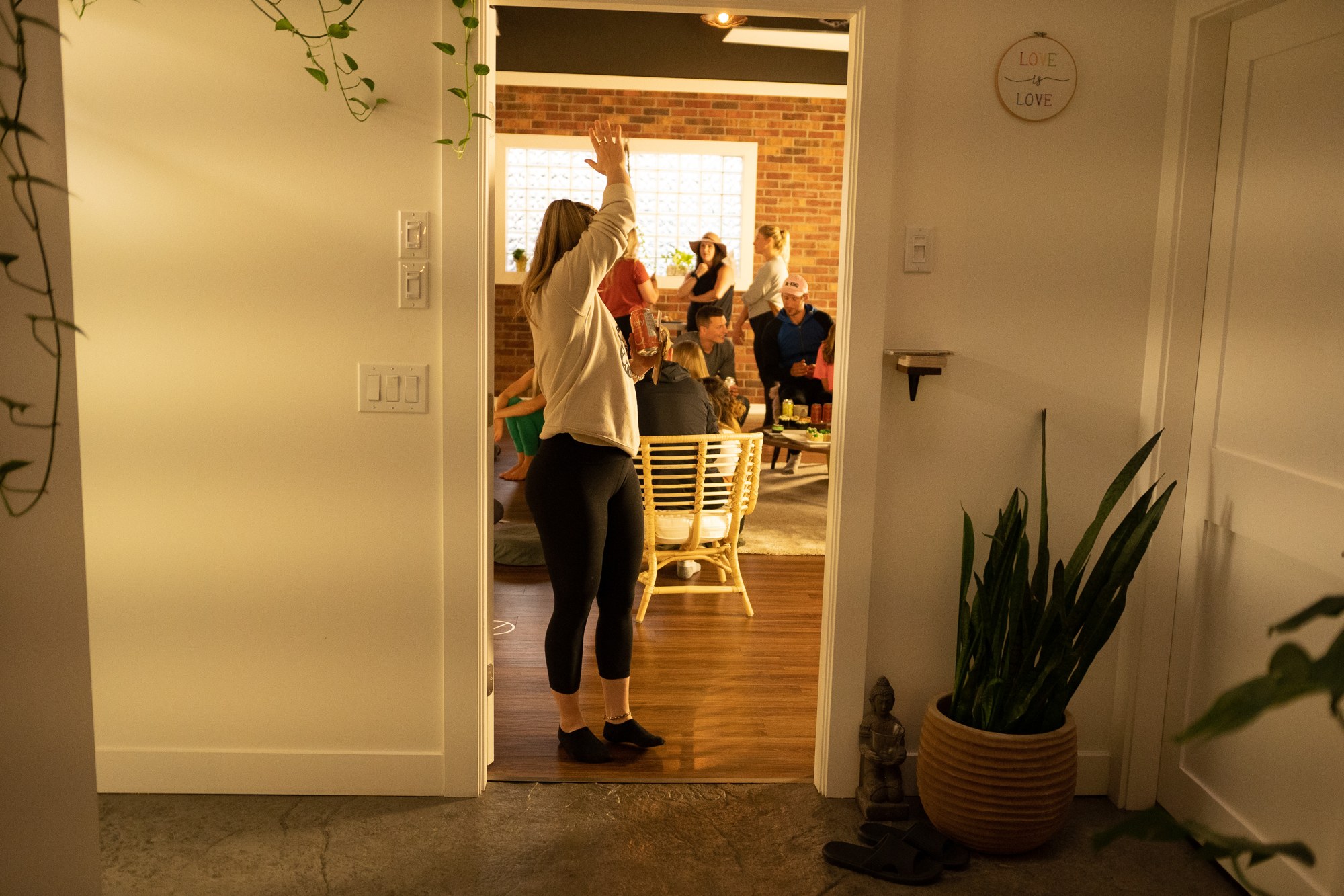 Our Yoga Space Turns Three: A view from the hallway into the gathering.