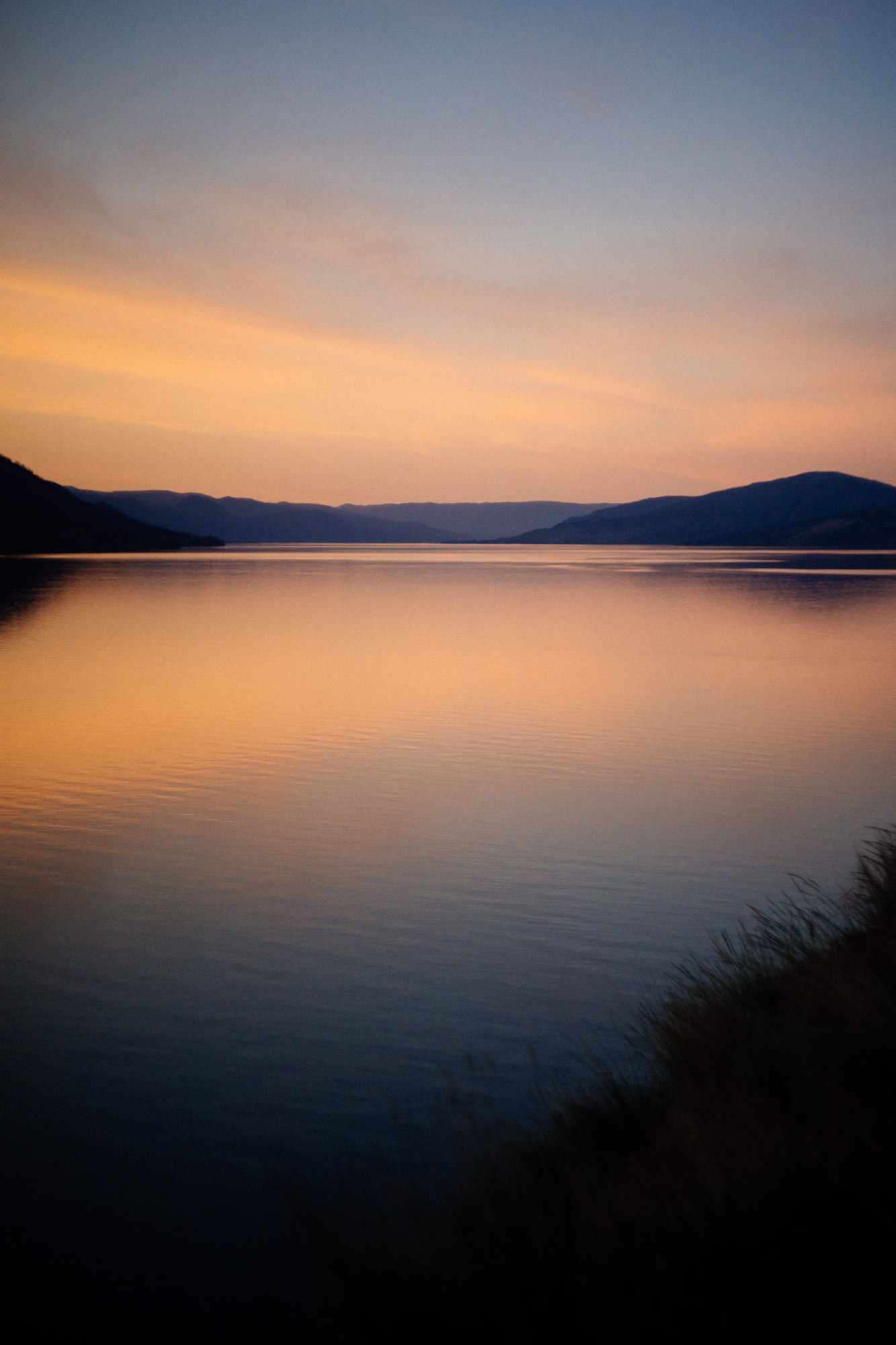 Evening Light at Paul’s Tomb: Orange dusk light reflected on the calm water.