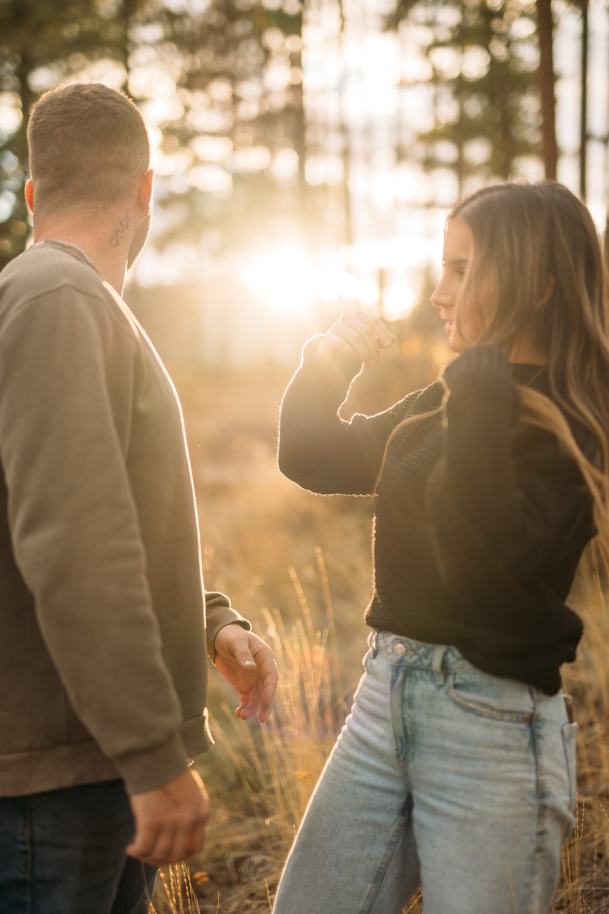 Rachel and Ryan portraits story frame 1: Okanagan couples portraits with dirt bikes, lake and mountain views, autumn sun, standing portraits and champagne celebration.