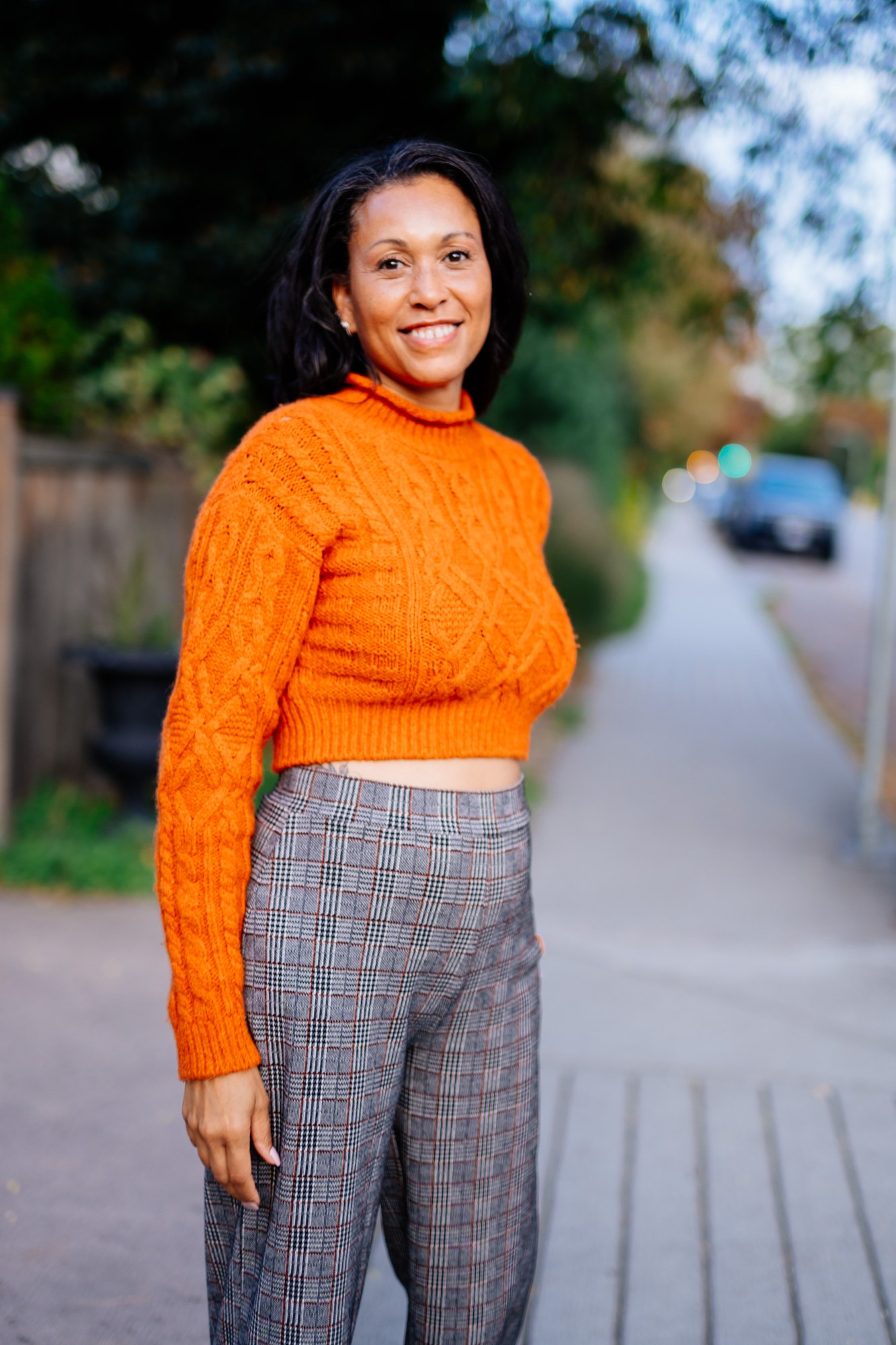 Rebekah in Autumn: Turned shoulder portrait with smile.