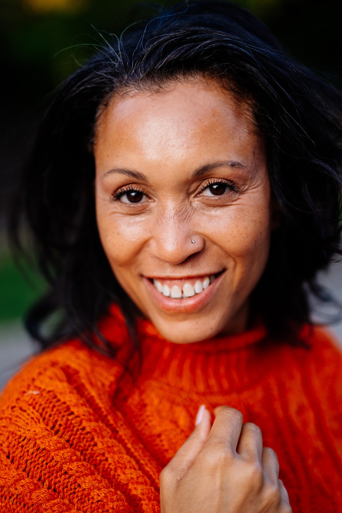 Rebekah in Autumn: Tight friendly smile with unobstructed eyes.