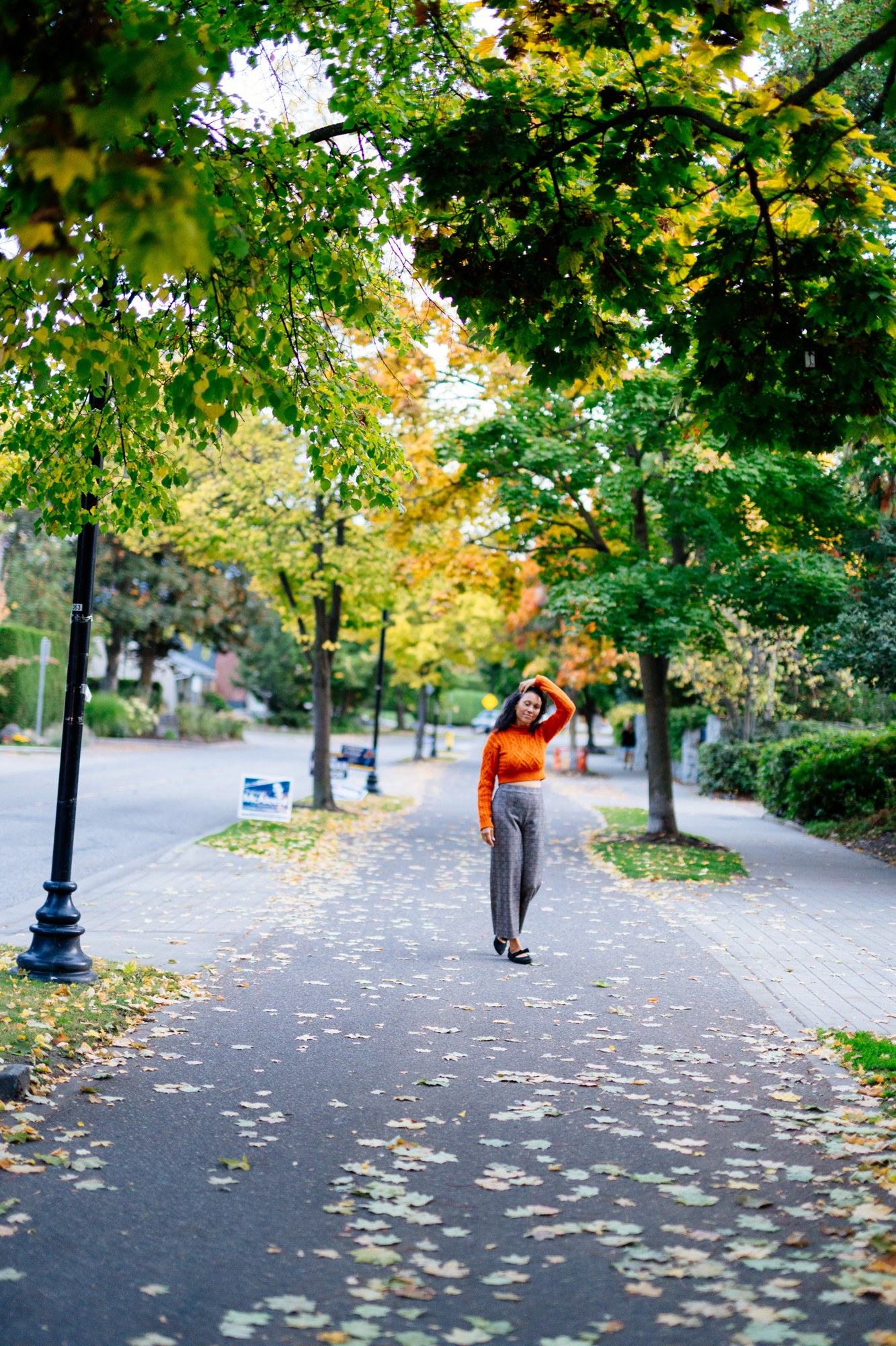 Rebekah in Autumn: Long view of subject within the tree-lined path.
