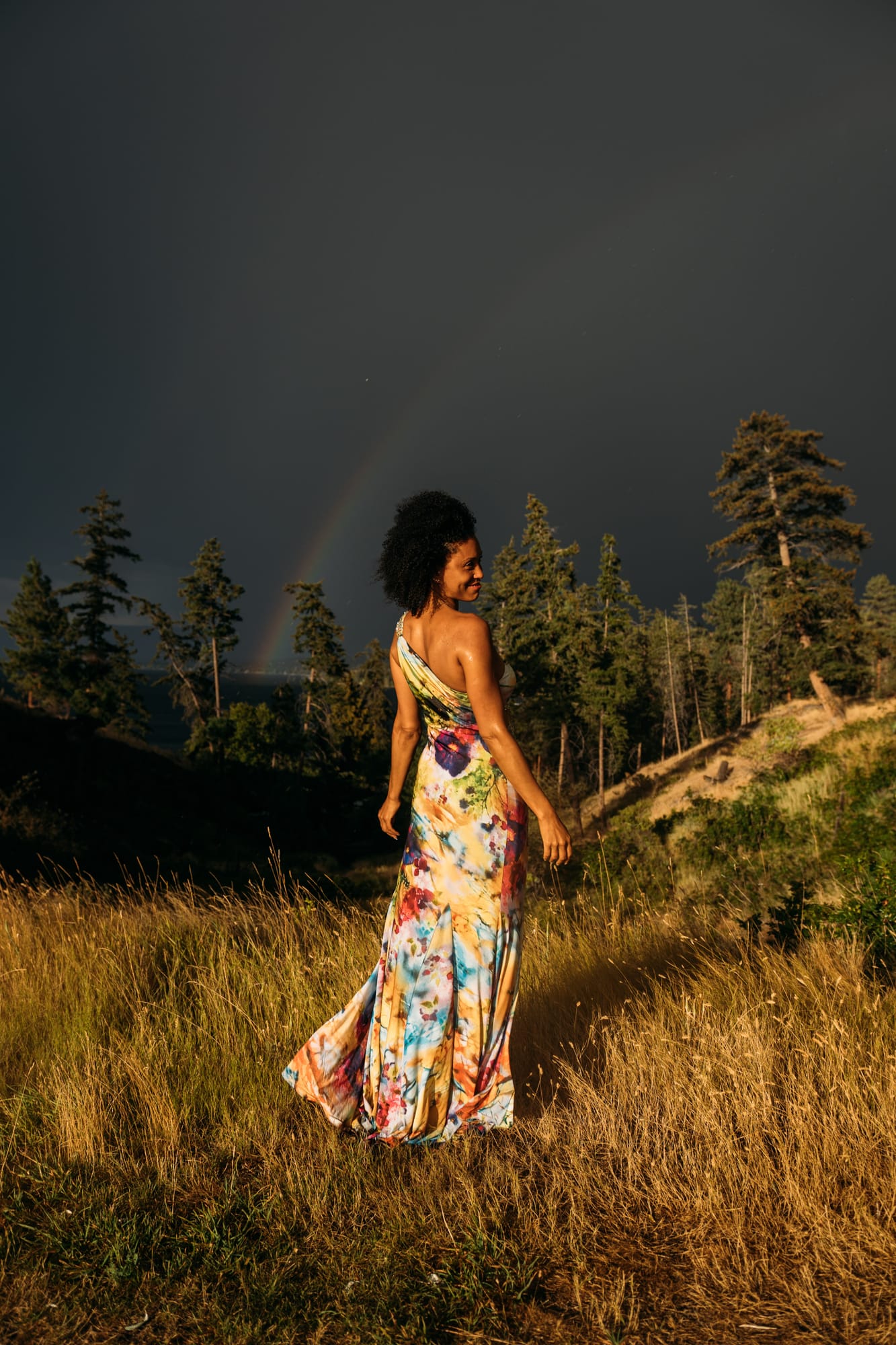 Rebekah at Bertram portraits story frame 4: A Bertram portrait story moving from floral dress and lake light into black dress, white shirt, sunset and water silhouettes..