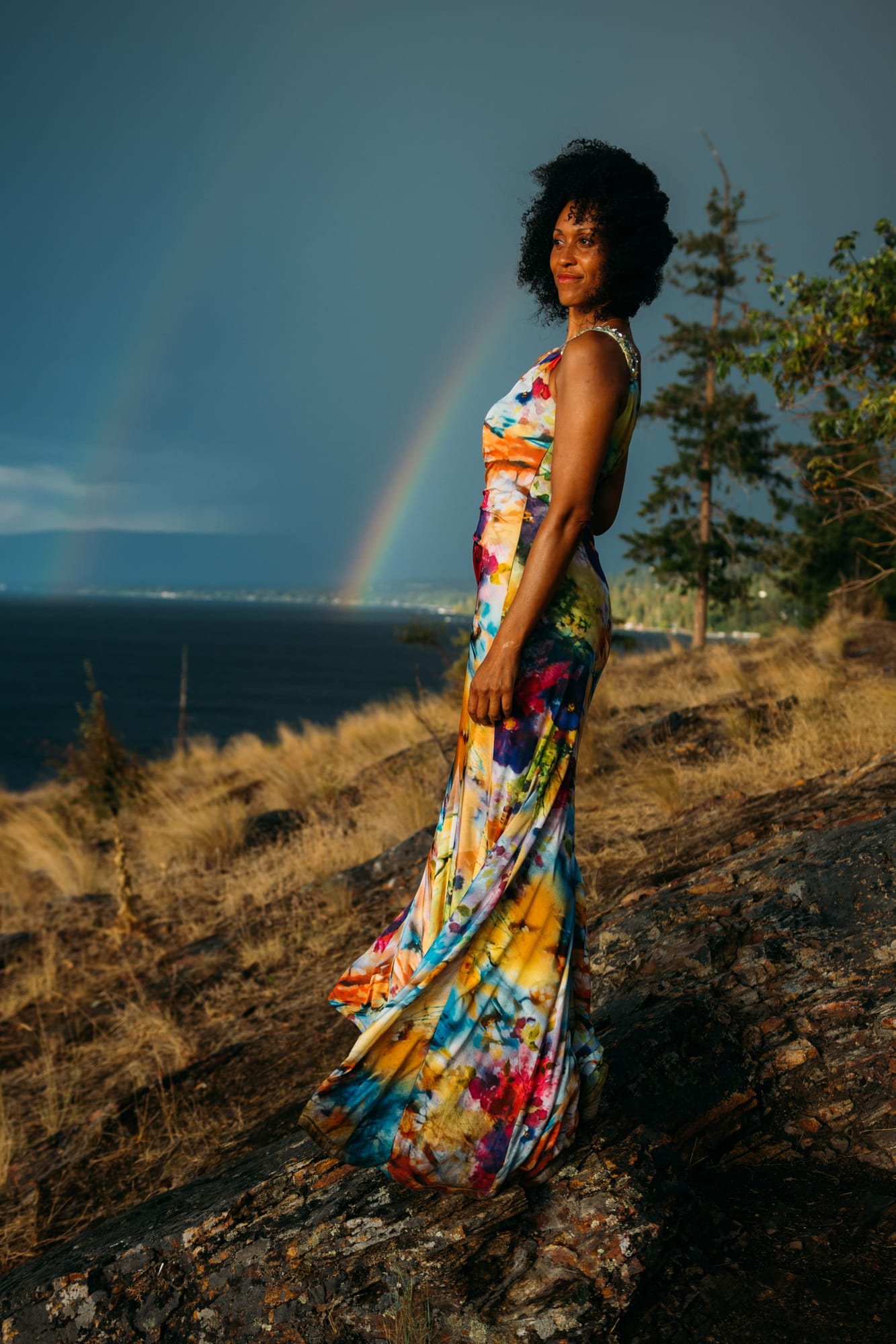 Rebekah at Bertram portraits story frame 5: A Bertram portrait story moving from floral dress and lake light into black dress, white shirt, sunset and water silhouettes..