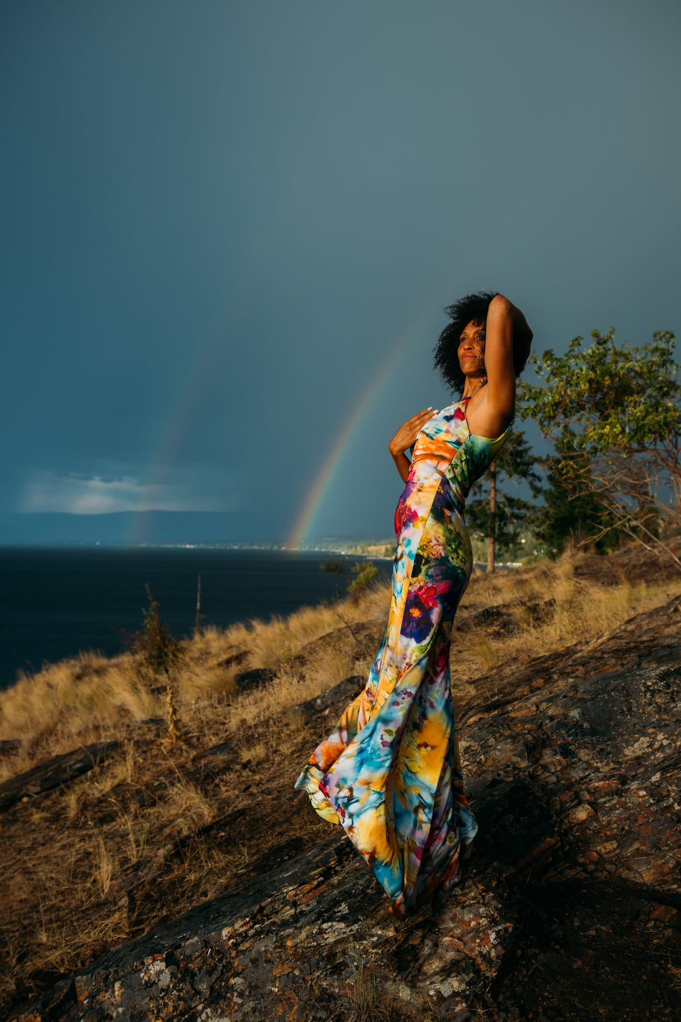 Rebekah at Bertram portraits story frame 6: A Bertram portrait story moving from floral dress and lake light into black dress, white shirt, sunset and water silhouettes..