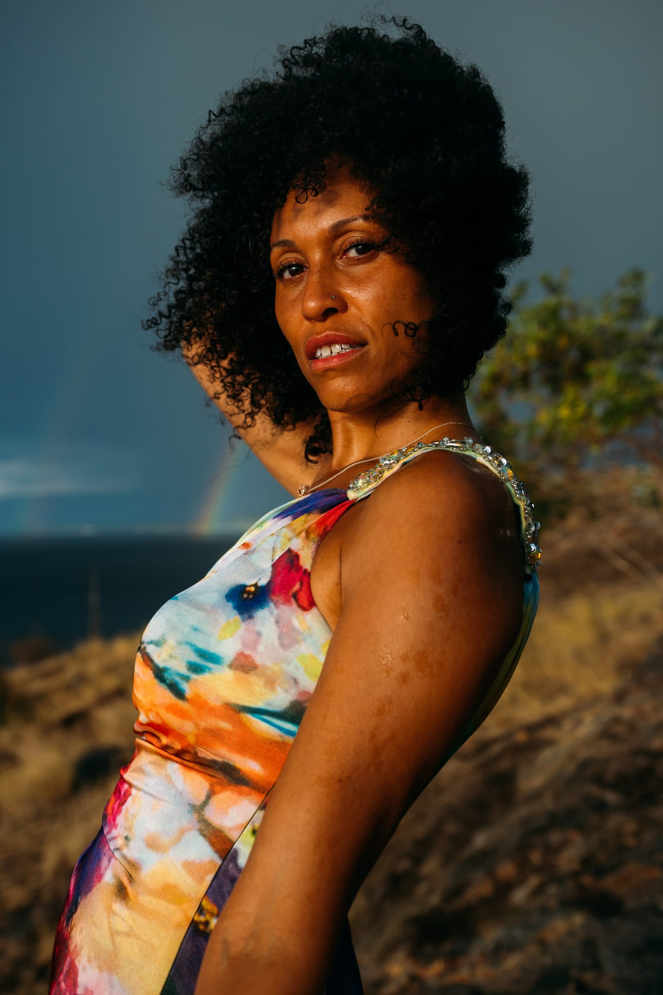 Rebekah at Bertram portraits story frame 7: A Bertram portrait story moving from floral dress and lake light into black dress, white shirt, sunset and water silhouettes..