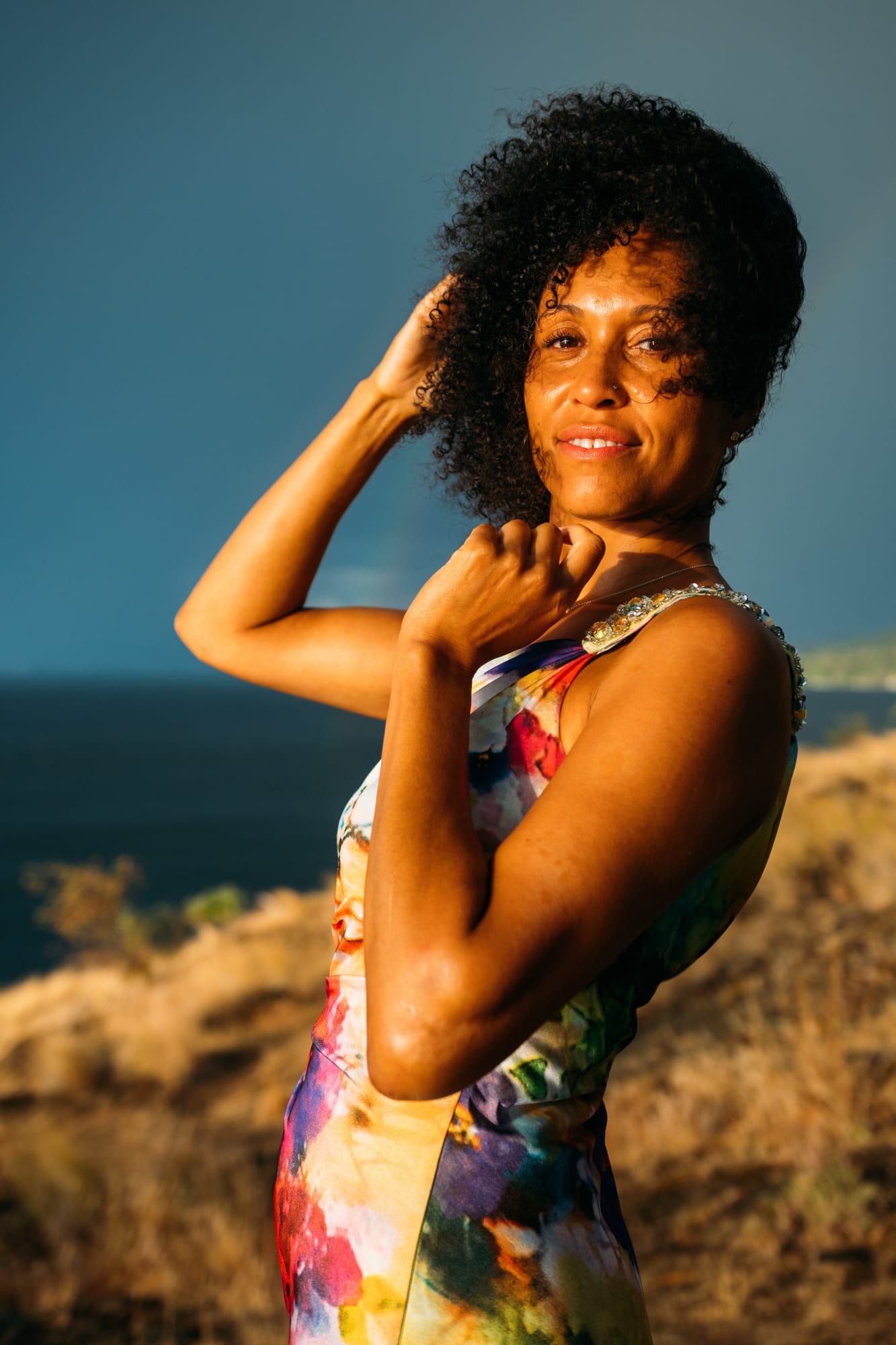 Rebekah at Bertram portraits story frame 8: A Bertram portrait story moving from floral dress and lake light into black dress, white shirt, sunset and water silhouettes..