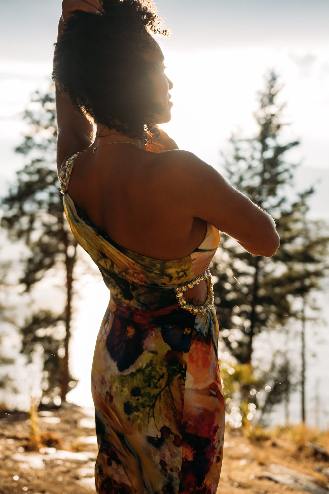 Rebekah at Bertram portraits story frame 9: A Bertram portrait story moving from floral dress and lake light into black dress, white shirt, sunset and water silhouettes..