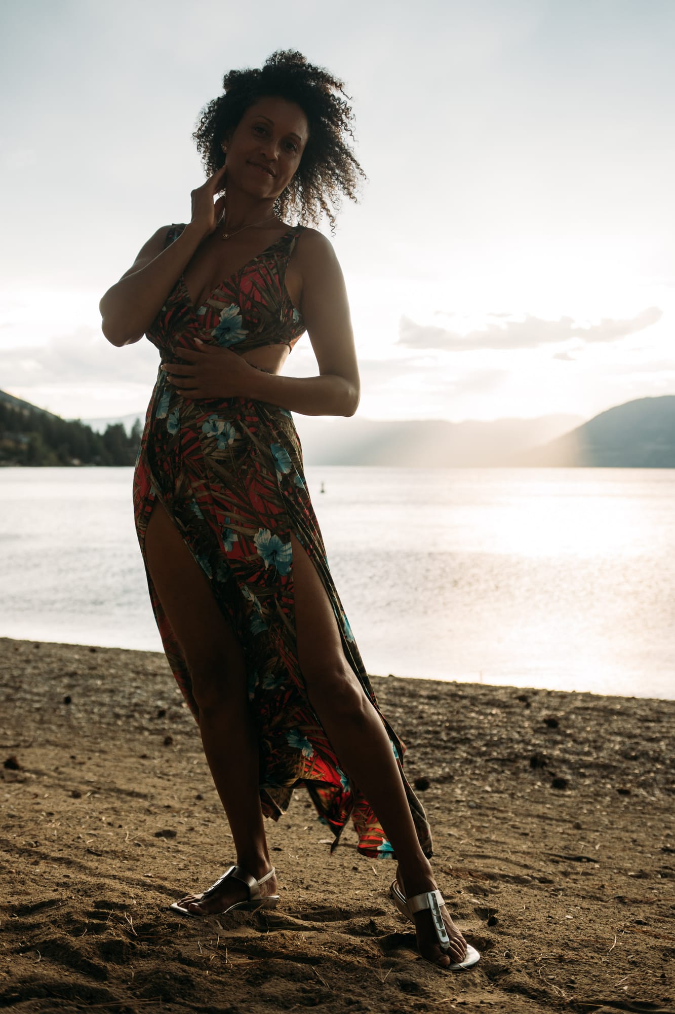 Rebekah at Bertram portraits story frame 11: A Bertram portrait story moving from floral dress and lake light into black dress, white shirt, sunset and water silhouettes..