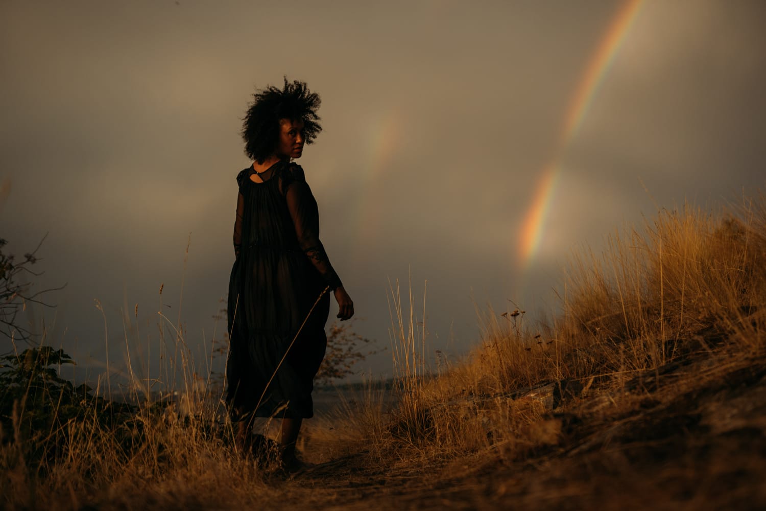Rebekah at Bertram portraits story frame 14: A Bertram portrait story moving from floral dress and lake light into black dress, white shirt, sunset and water silhouettes..