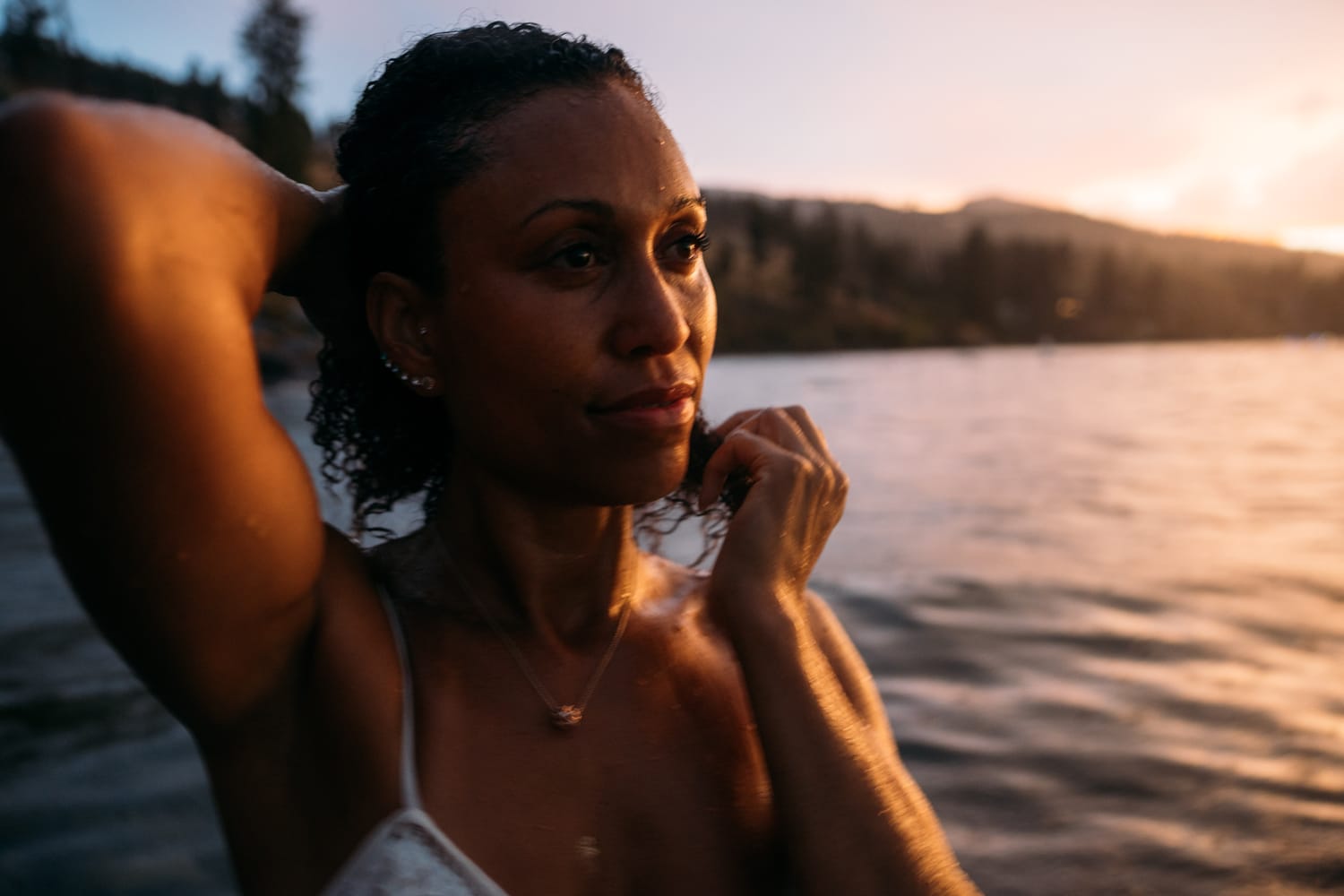 Rebekah at Bertram portraits story frame 21: A Bertram portrait story moving from floral dress and lake light into black dress, white shirt, sunset and water silhouettes..